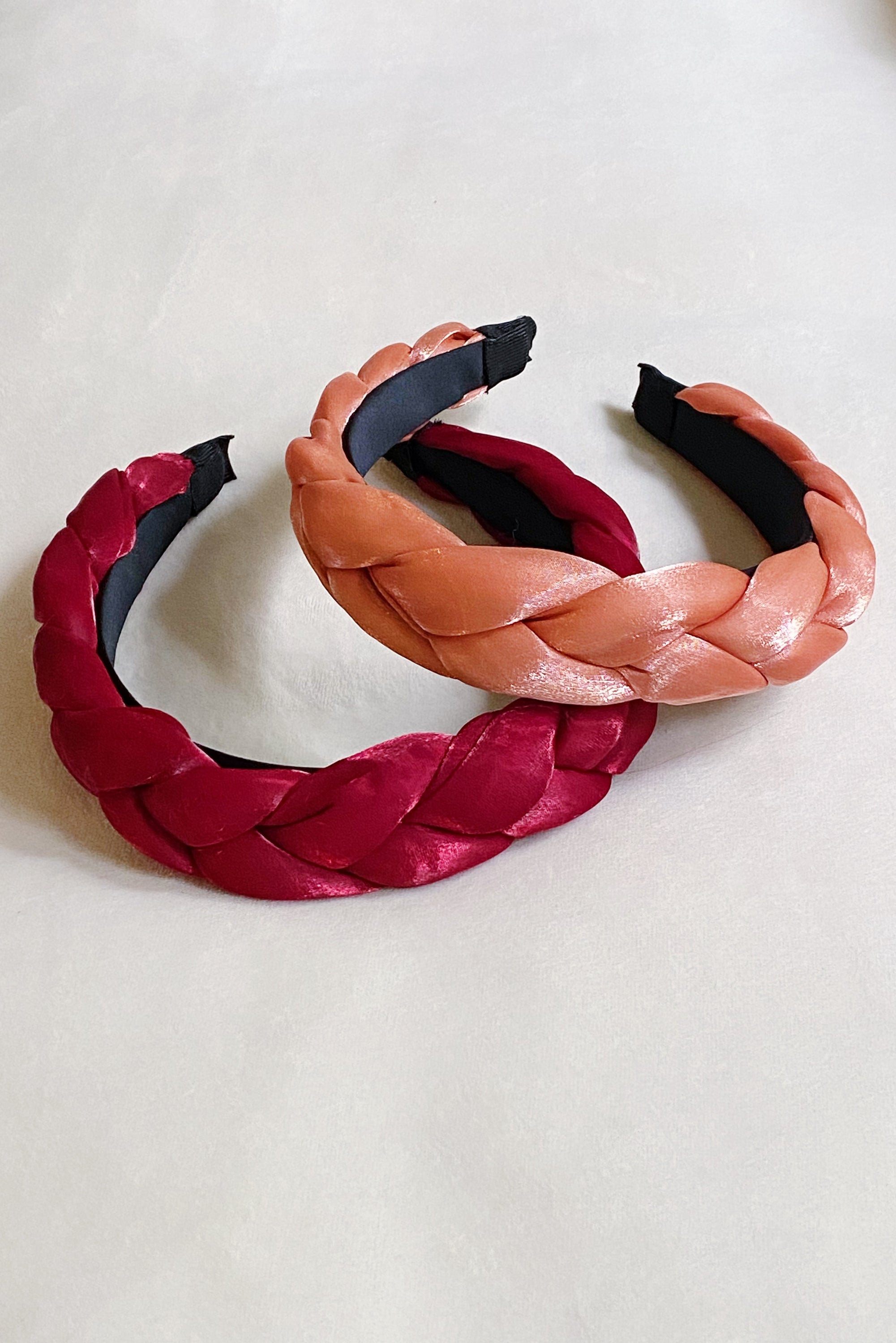 A stylish chunky braided headband with soft edges, perfect for trendy hairstyles.