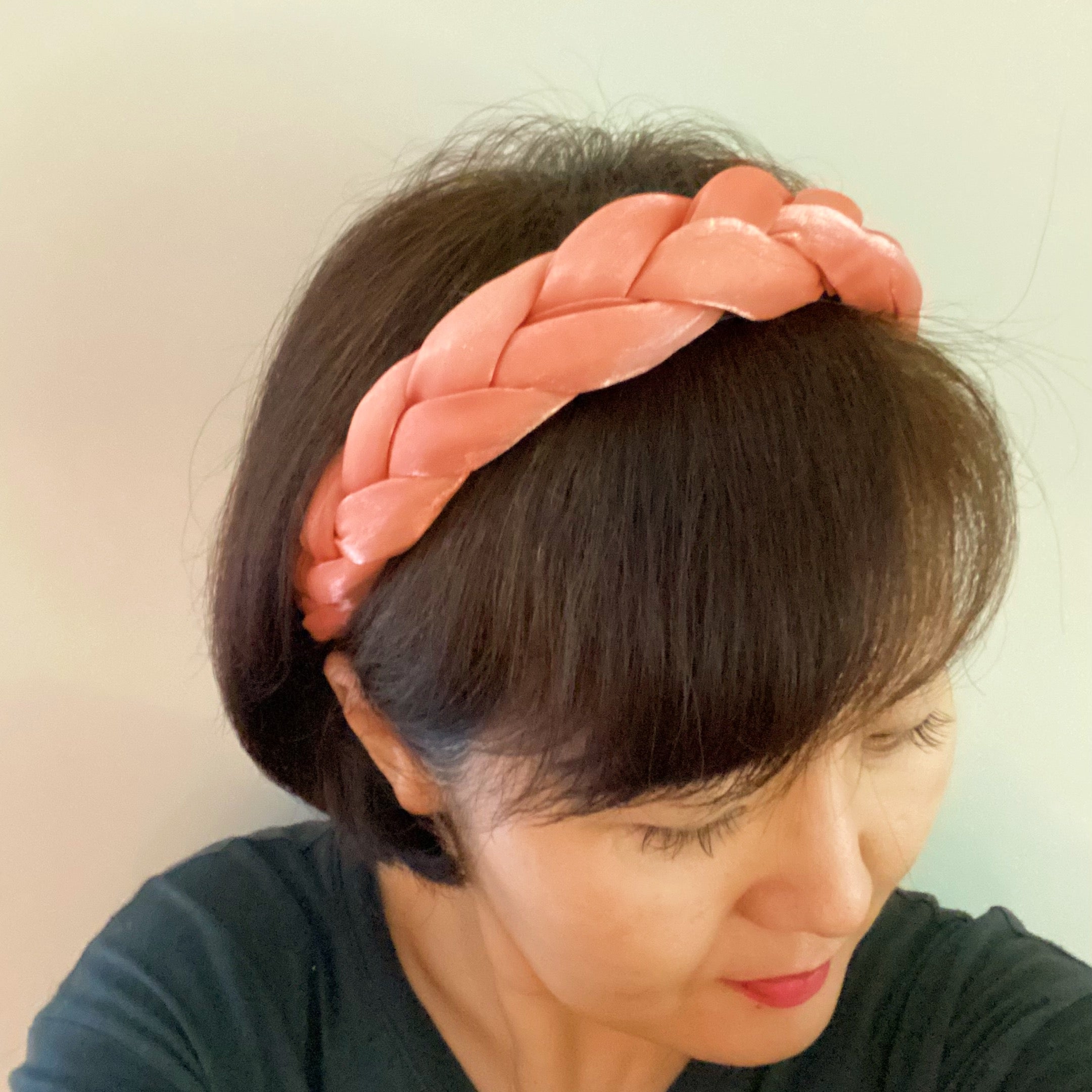 A stylish chunky braided headband with soft edges, perfect for trendy hairstyles.