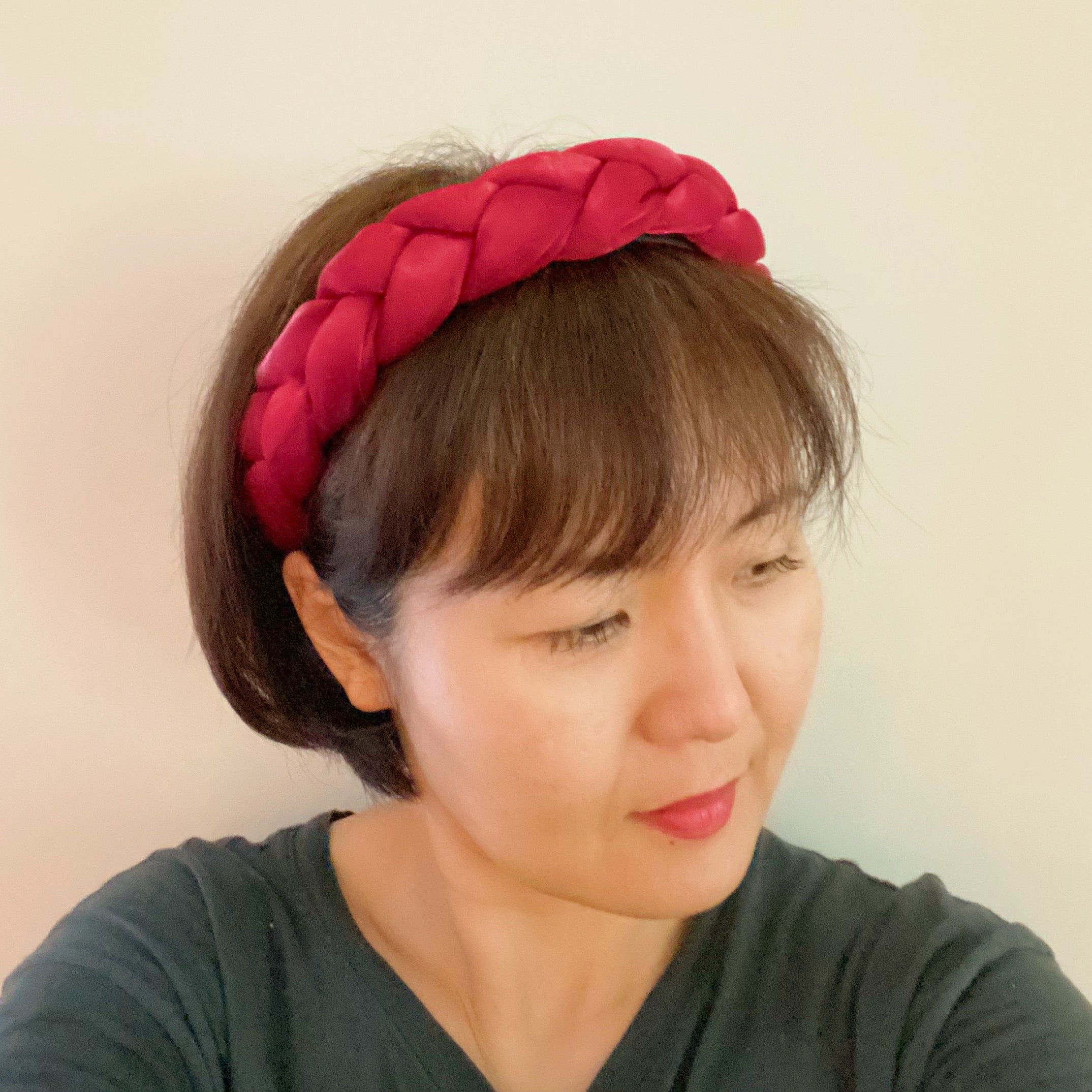 A stylish chunky braided headband with soft edges, perfect for trendy hairstyles.