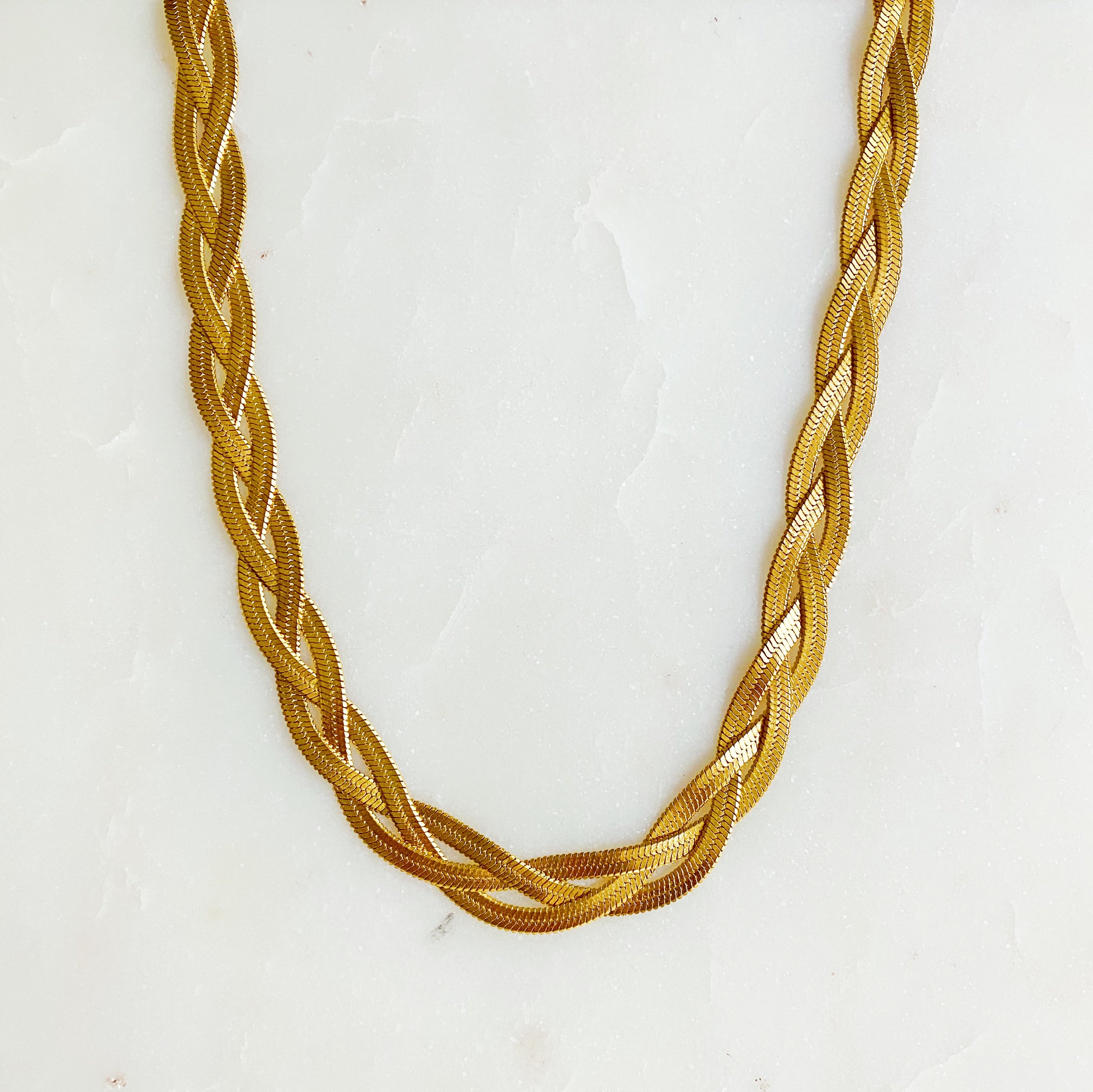 Elegant Braided Herringbone Chain Necklace made of stainless steel with 18K gold plating, featuring a trendy braided design.