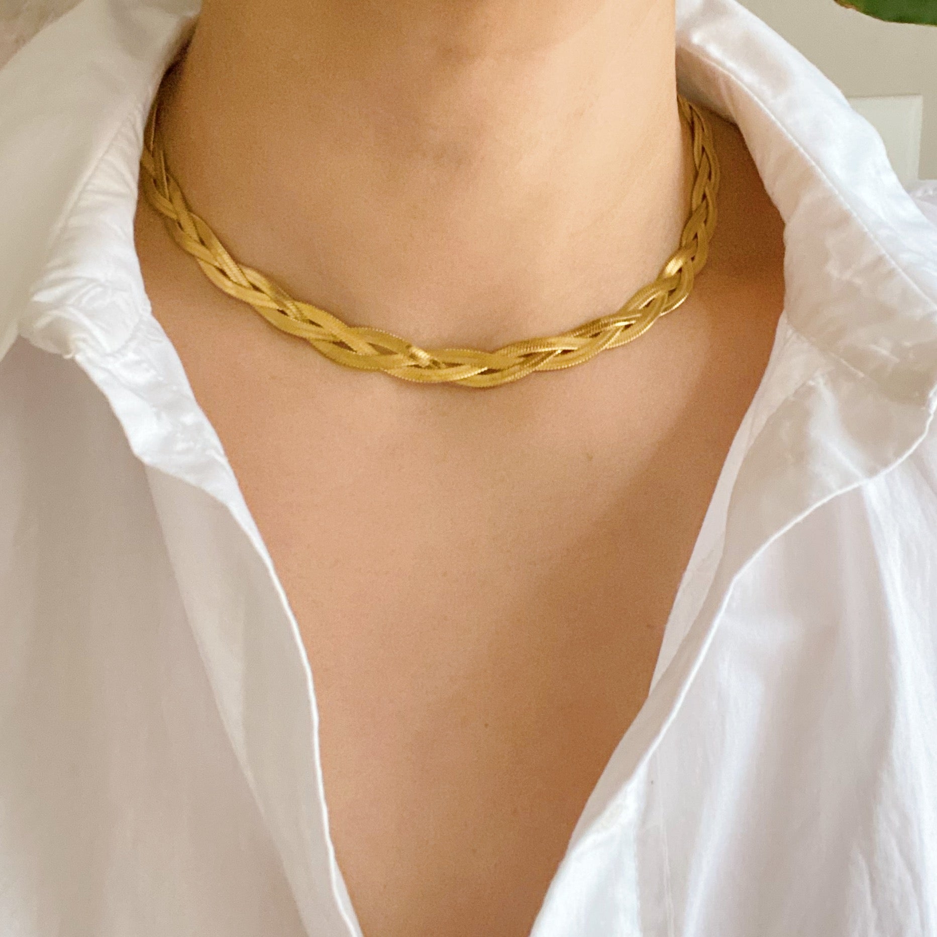 Elegant Braided Herringbone Chain Necklace made of stainless steel with 18K gold plating, featuring a trendy braided design.