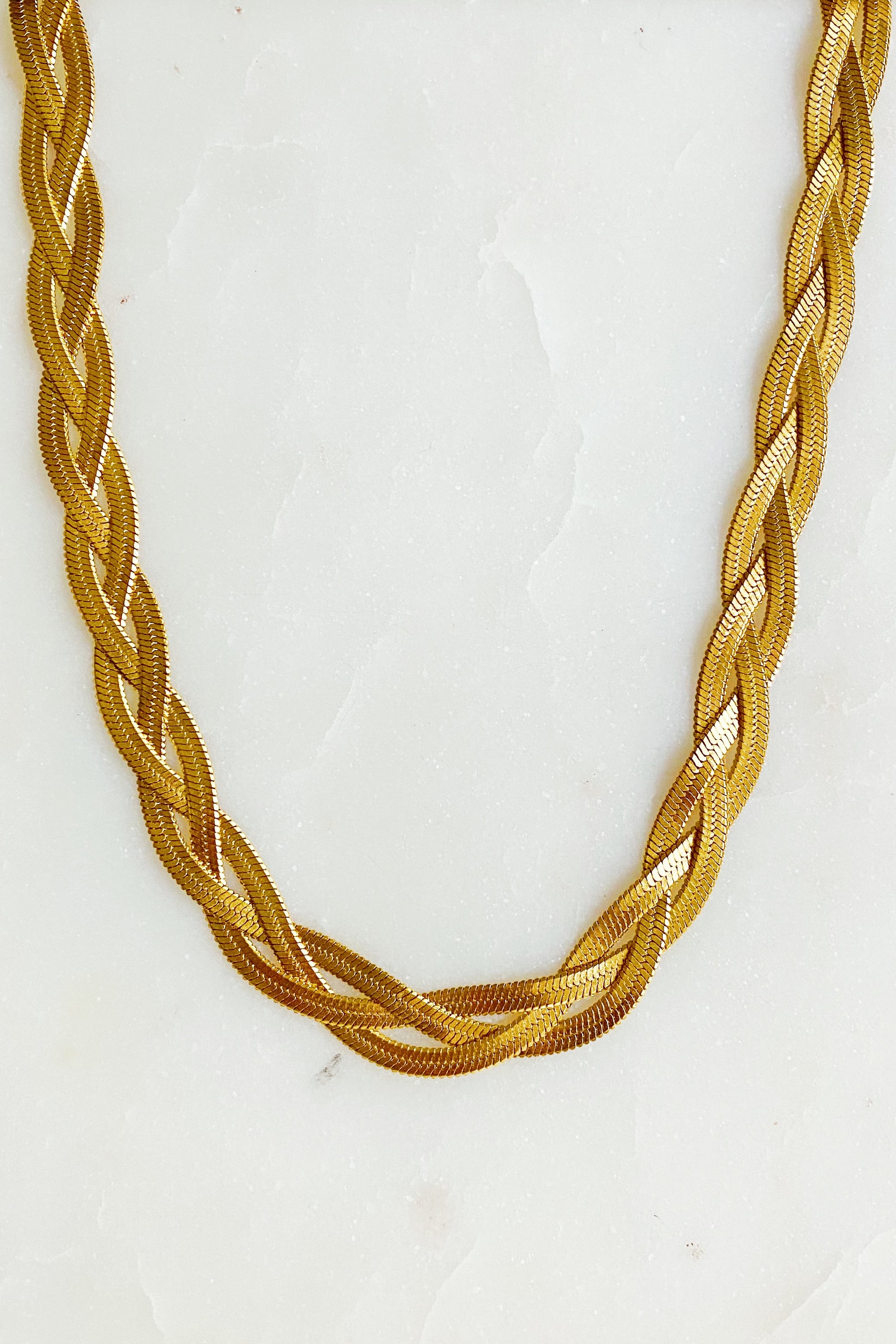 Elegant Braided Herringbone Chain Necklace made of stainless steel with 18K gold plating, featuring a trendy braided design.