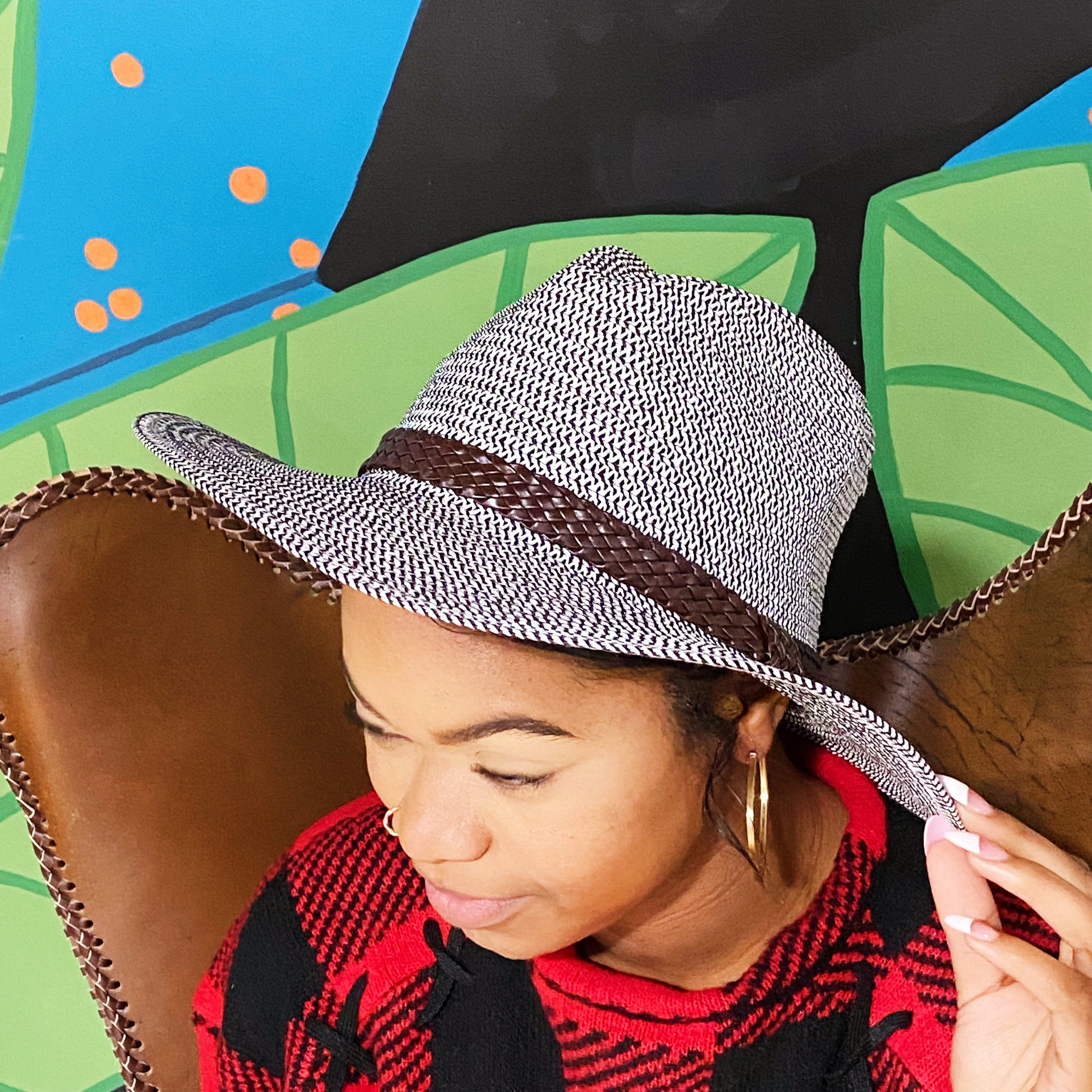 Braided Panama Fedora with faux leather band, stylish summer accessory.