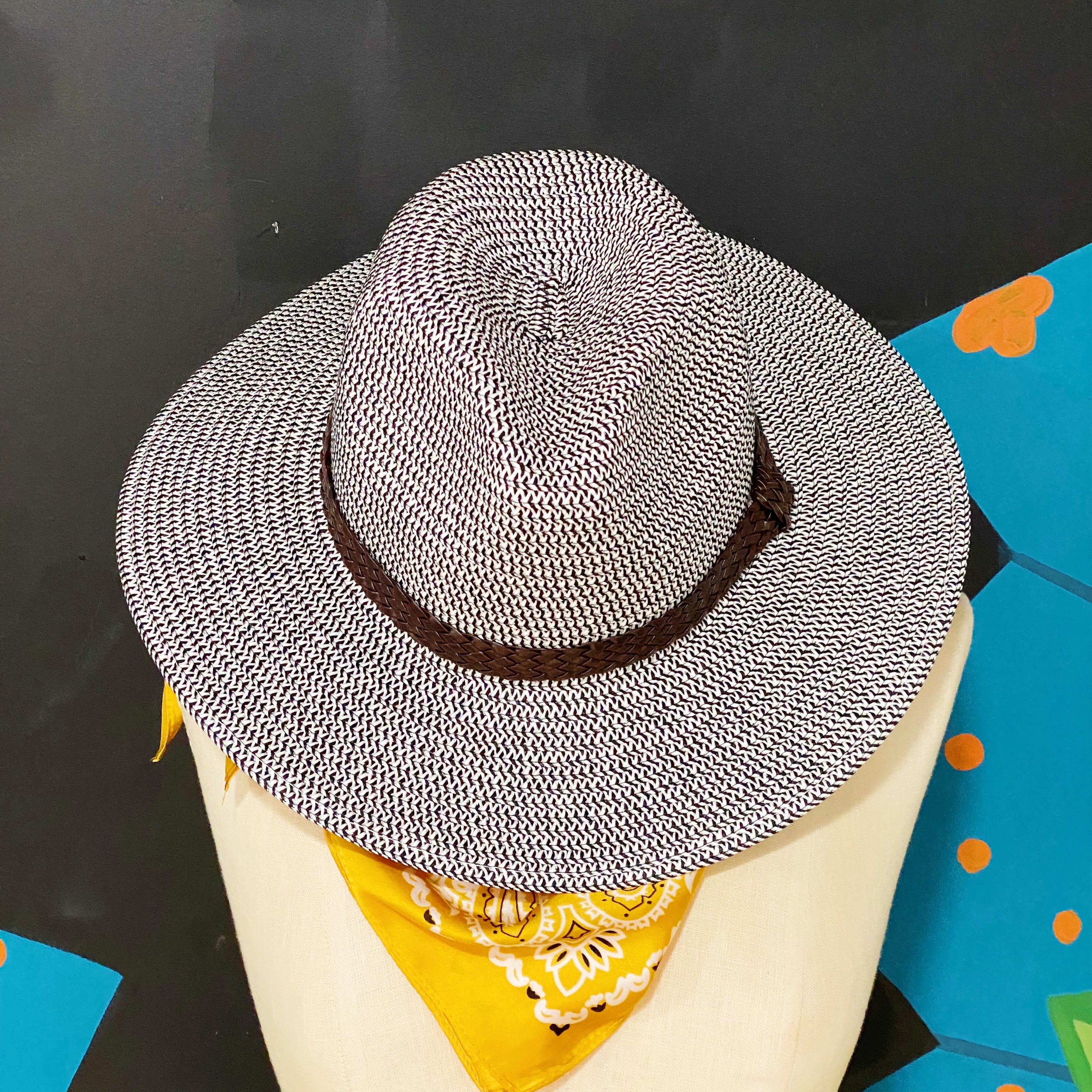 Braided Panama Fedora with faux leather band, stylish summer accessory.