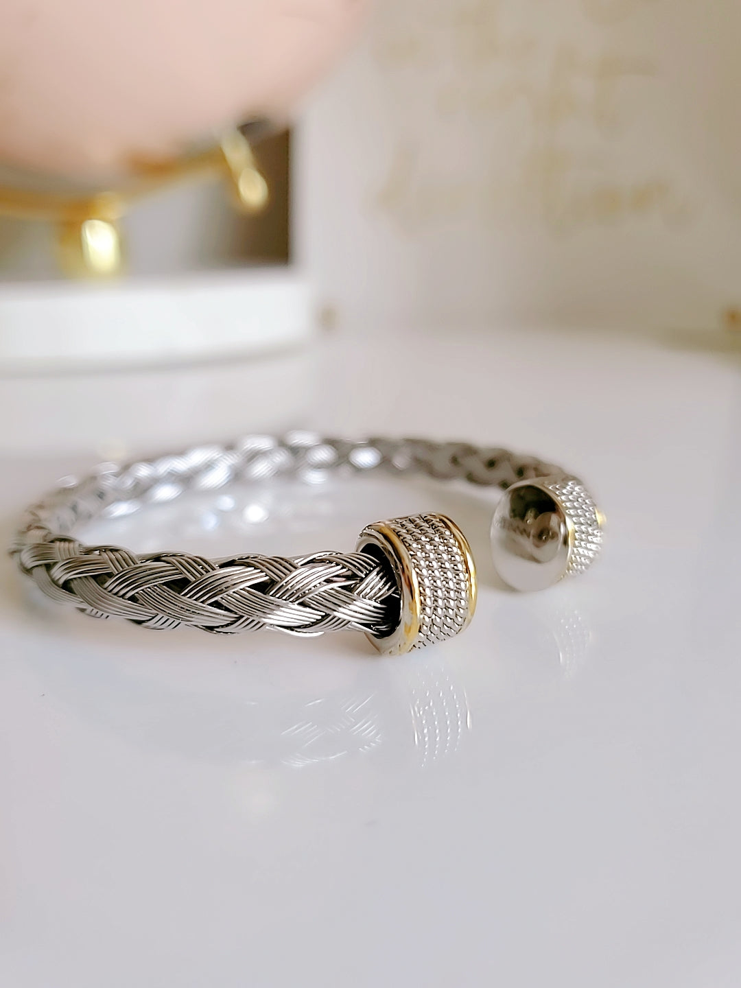 Elegant Braided Silver Cable Bangle Bracelet made of stainless steel and gold filled, showcasing intricate braided design.