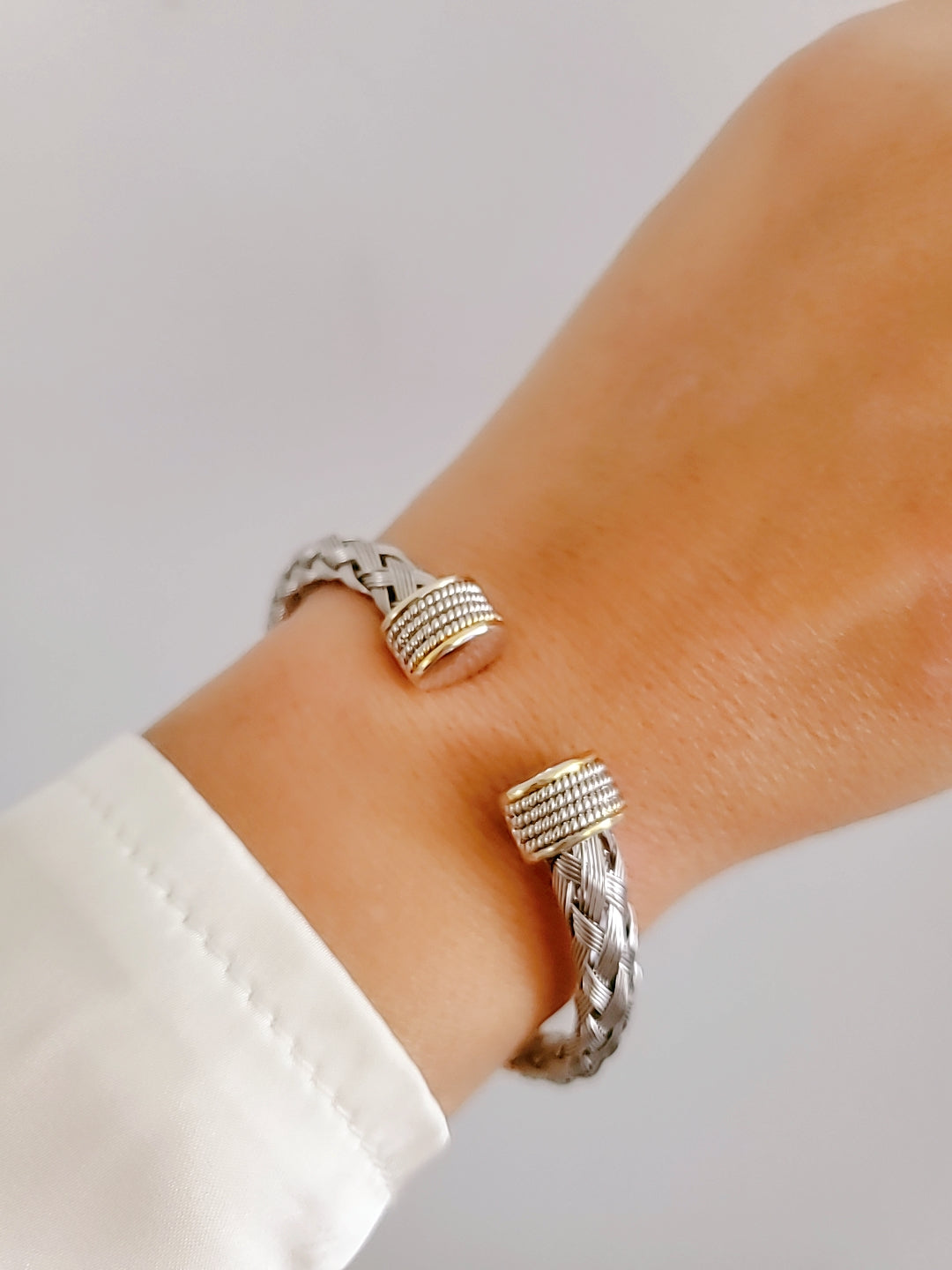 Elegant Braided Silver Cable Bangle Bracelet made of stainless steel and gold filled, showcasing intricate braided design.