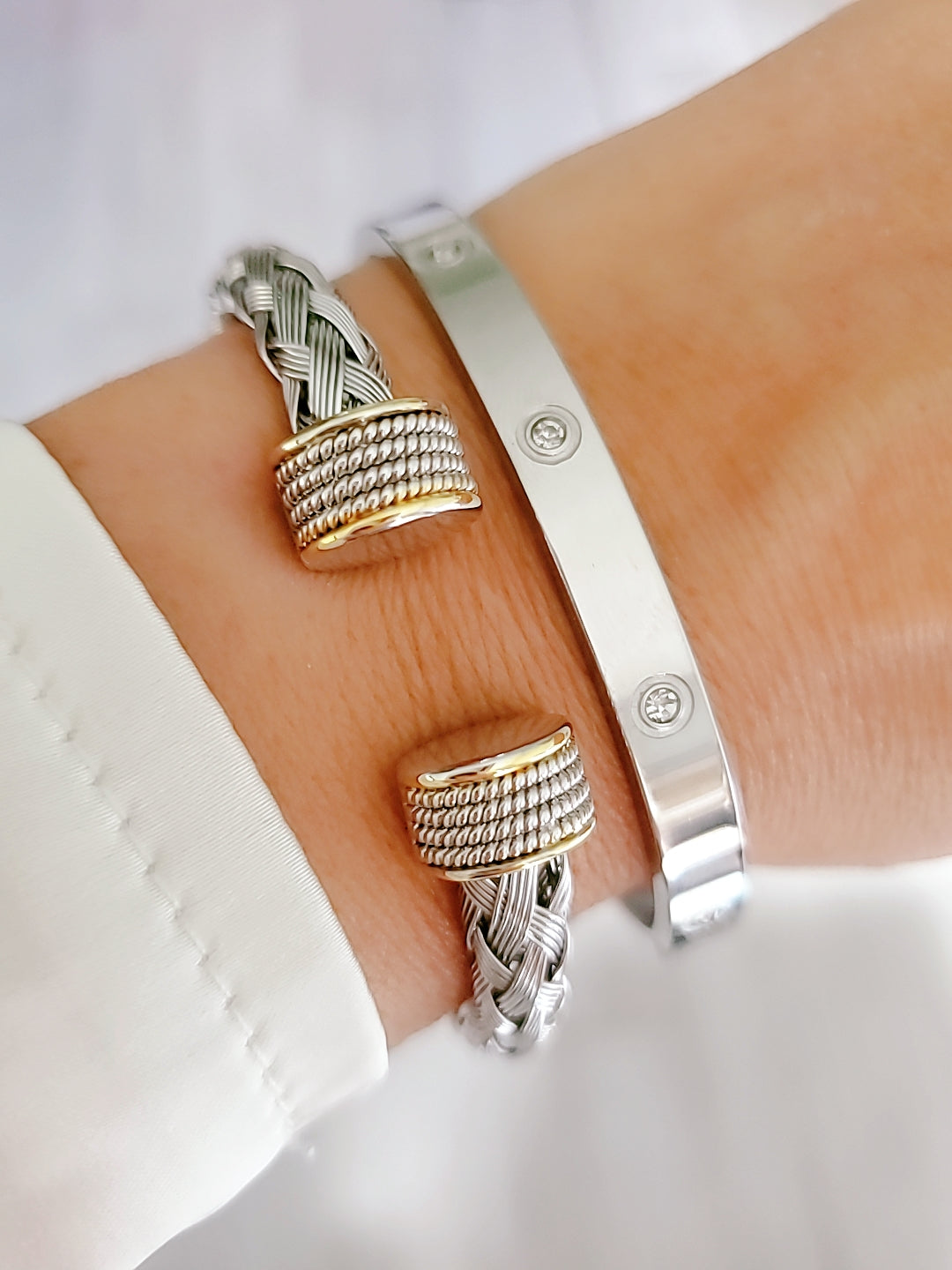 Elegant Braided Silver Cable Bangle Bracelet made of stainless steel and gold filled, showcasing intricate braided design.