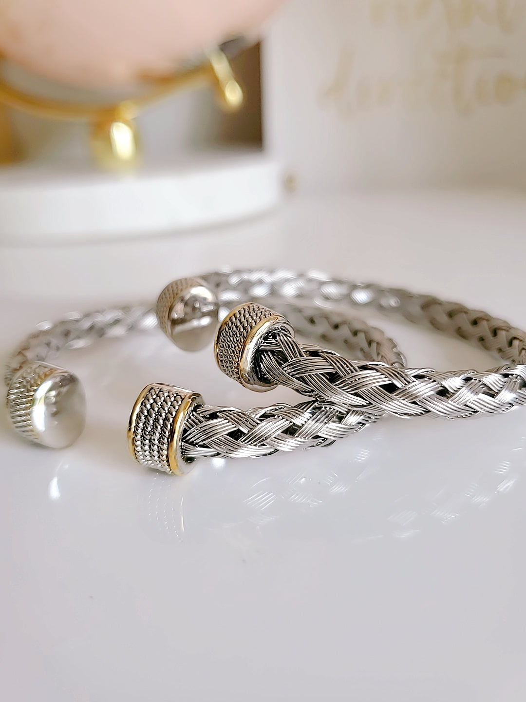 Elegant Braided Silver Cable Bangle Bracelet made of stainless steel and gold filled, showcasing intricate braided design.