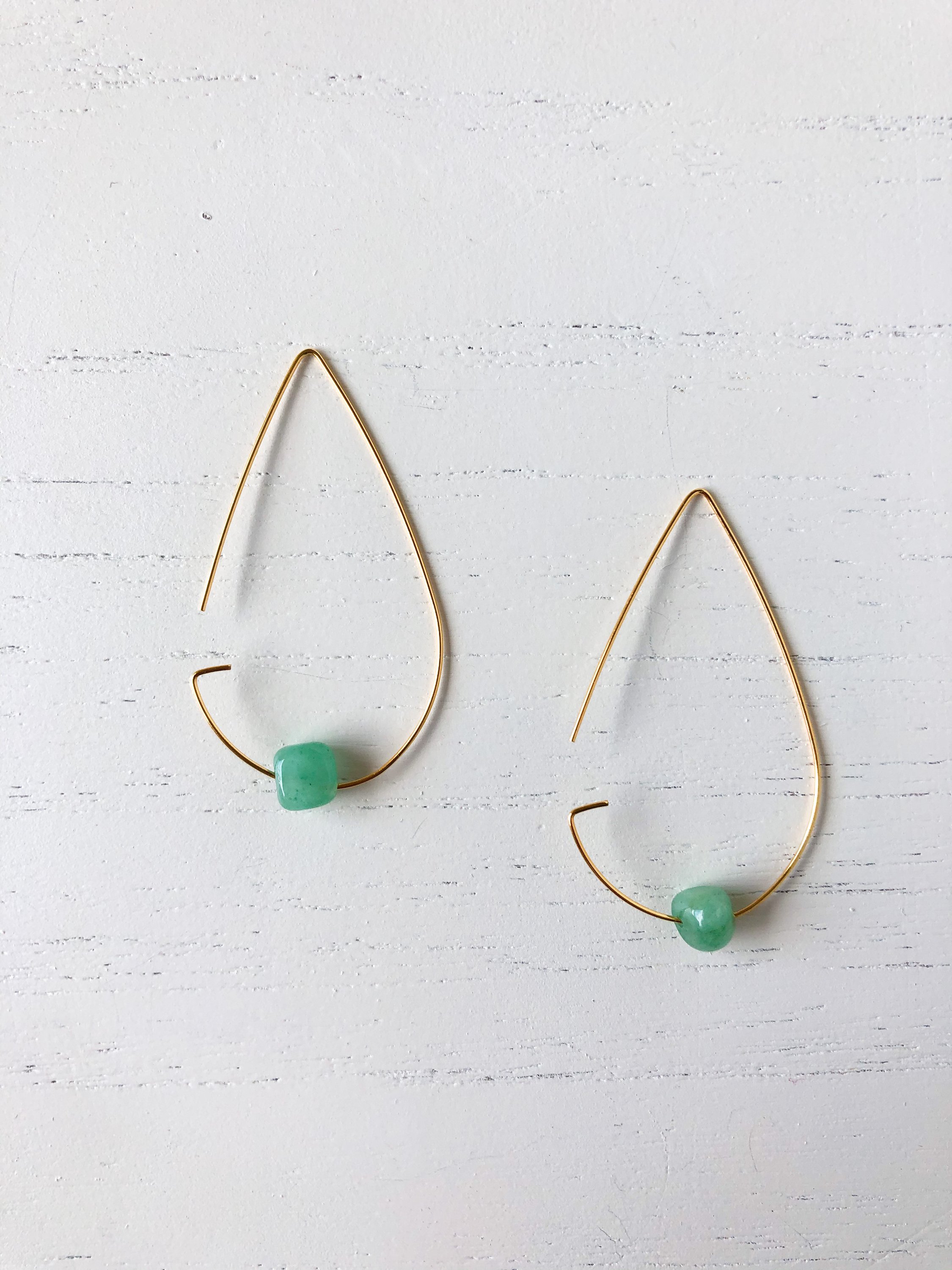 Brass tear drop threader earrings featuring jade stone, elegantly designed for stylish wear.