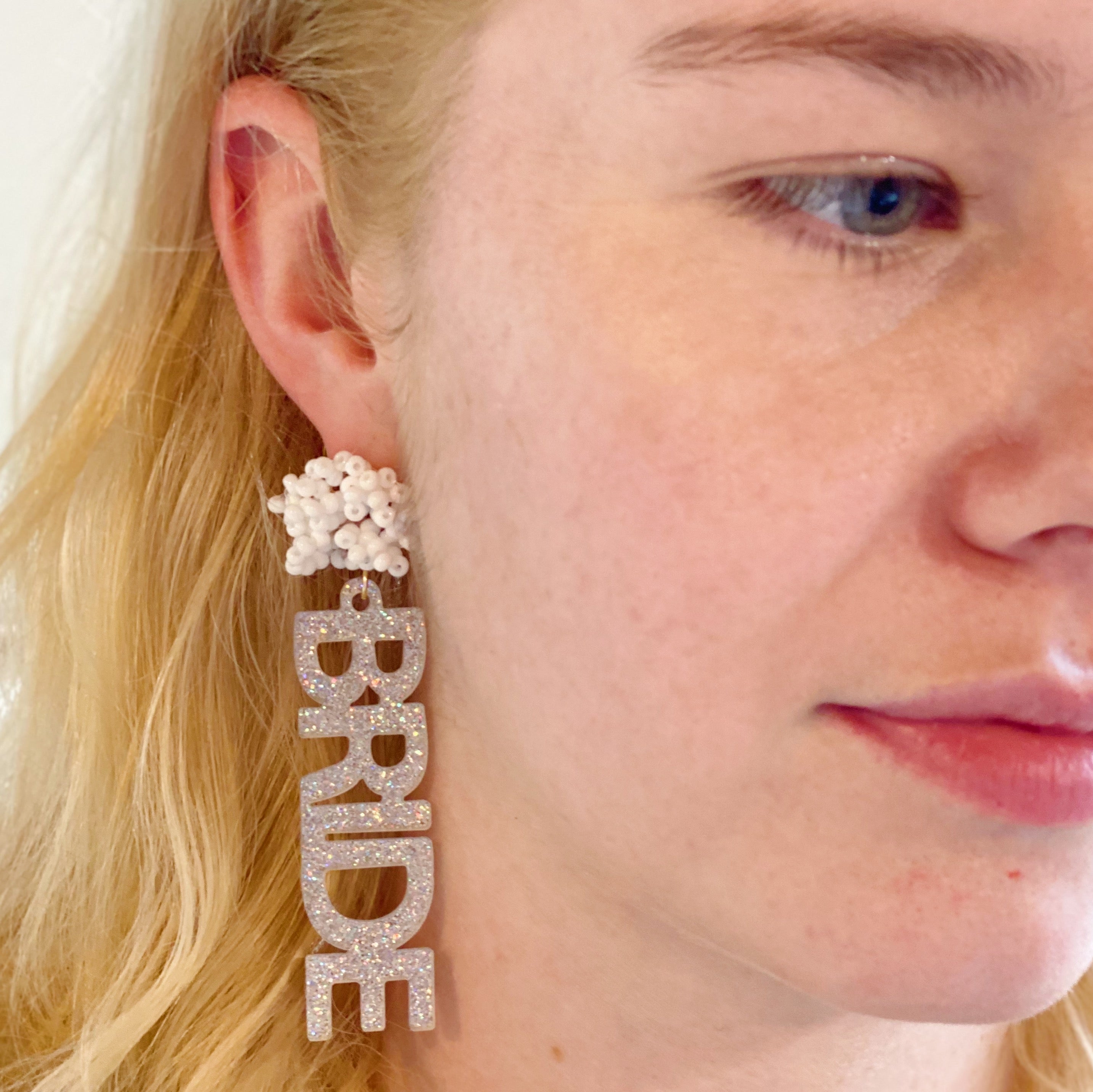 Bride Babe Cutout Acrylic Earrings featuring glittery 'BRIDE' design, perfect for bridal occasions.