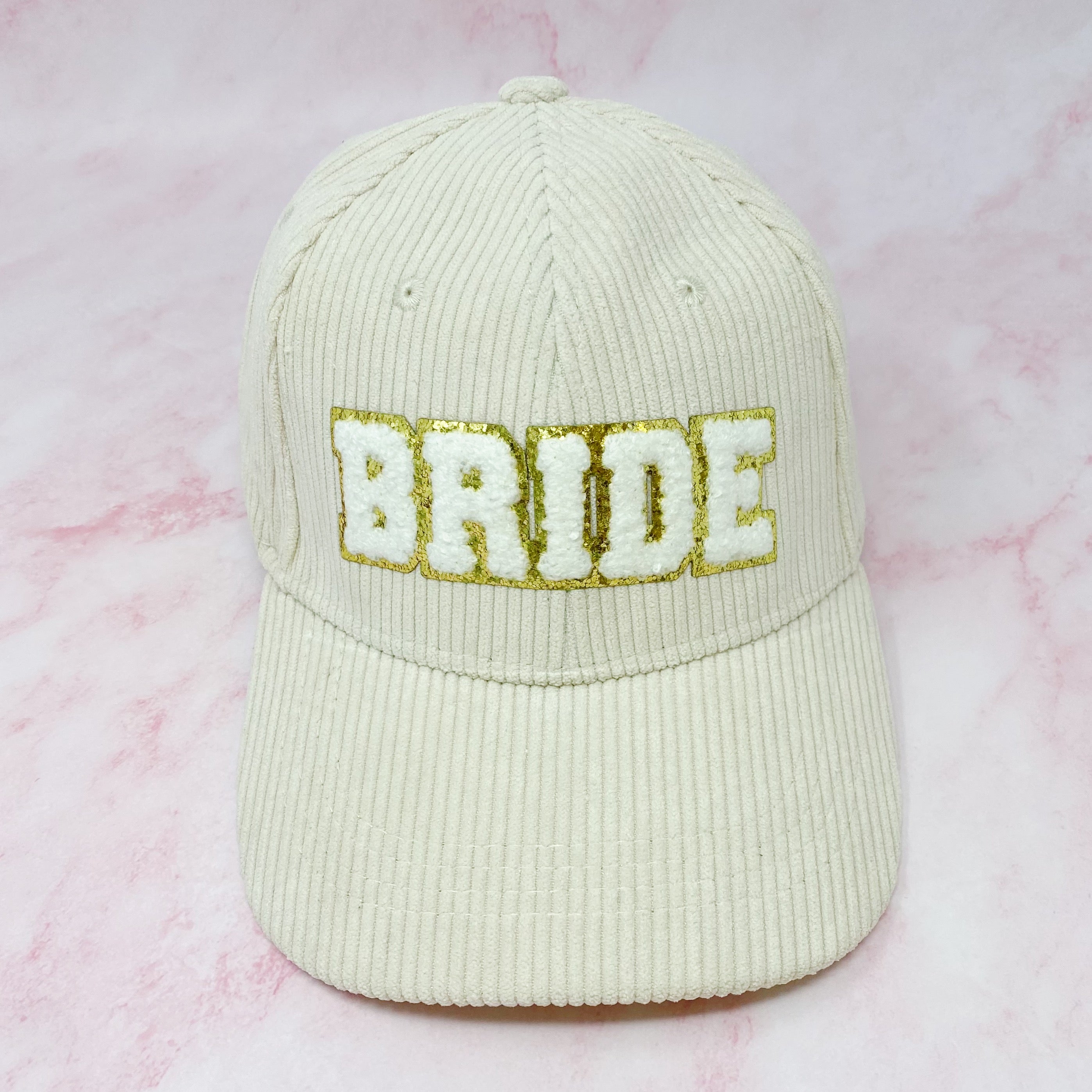 Bride Corduroy Ball Cap featuring gold glittering fuzzy patch lettering and adjustable strap.