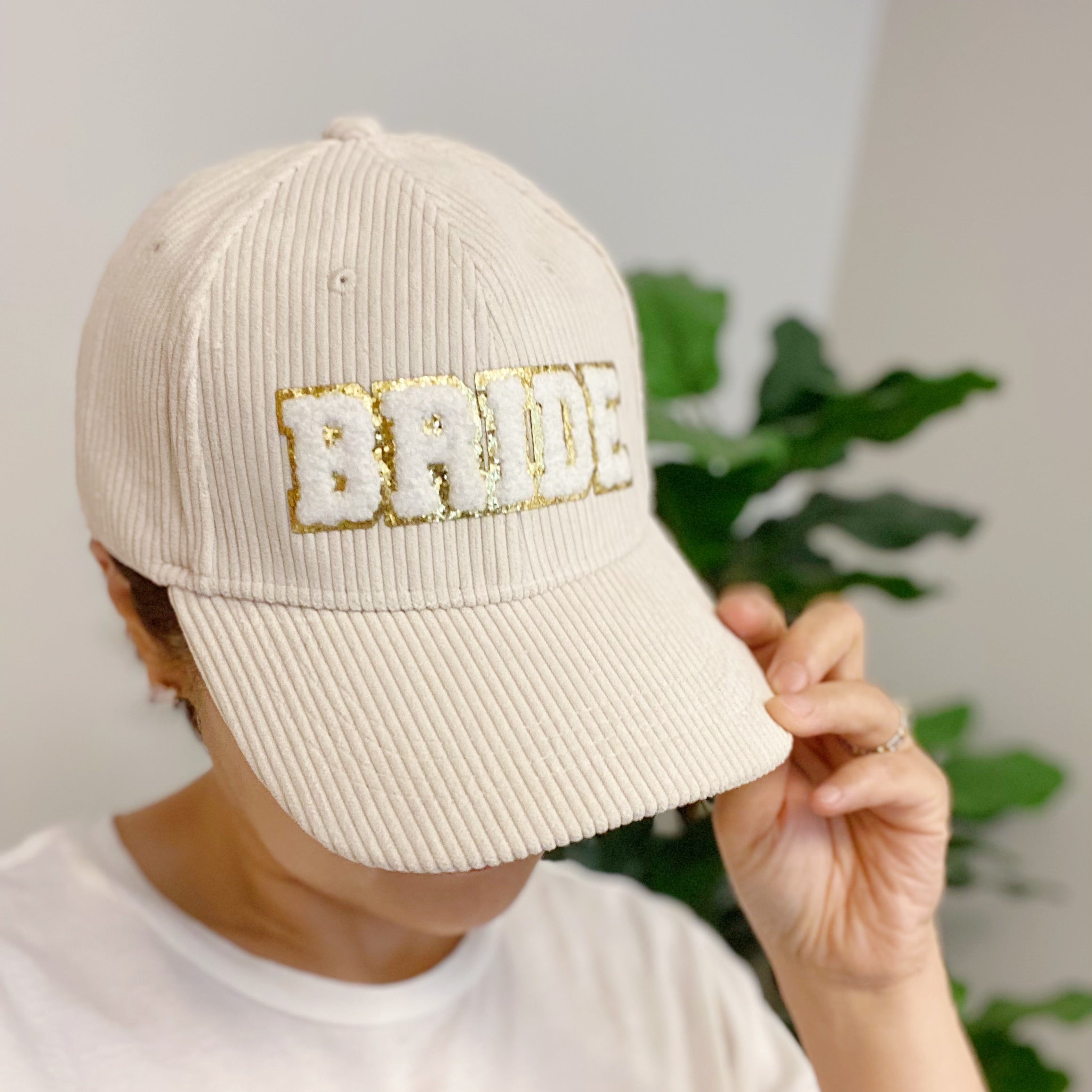 Bride Corduroy Ball Cap featuring gold glittering fuzzy patch lettering and adjustable strap.