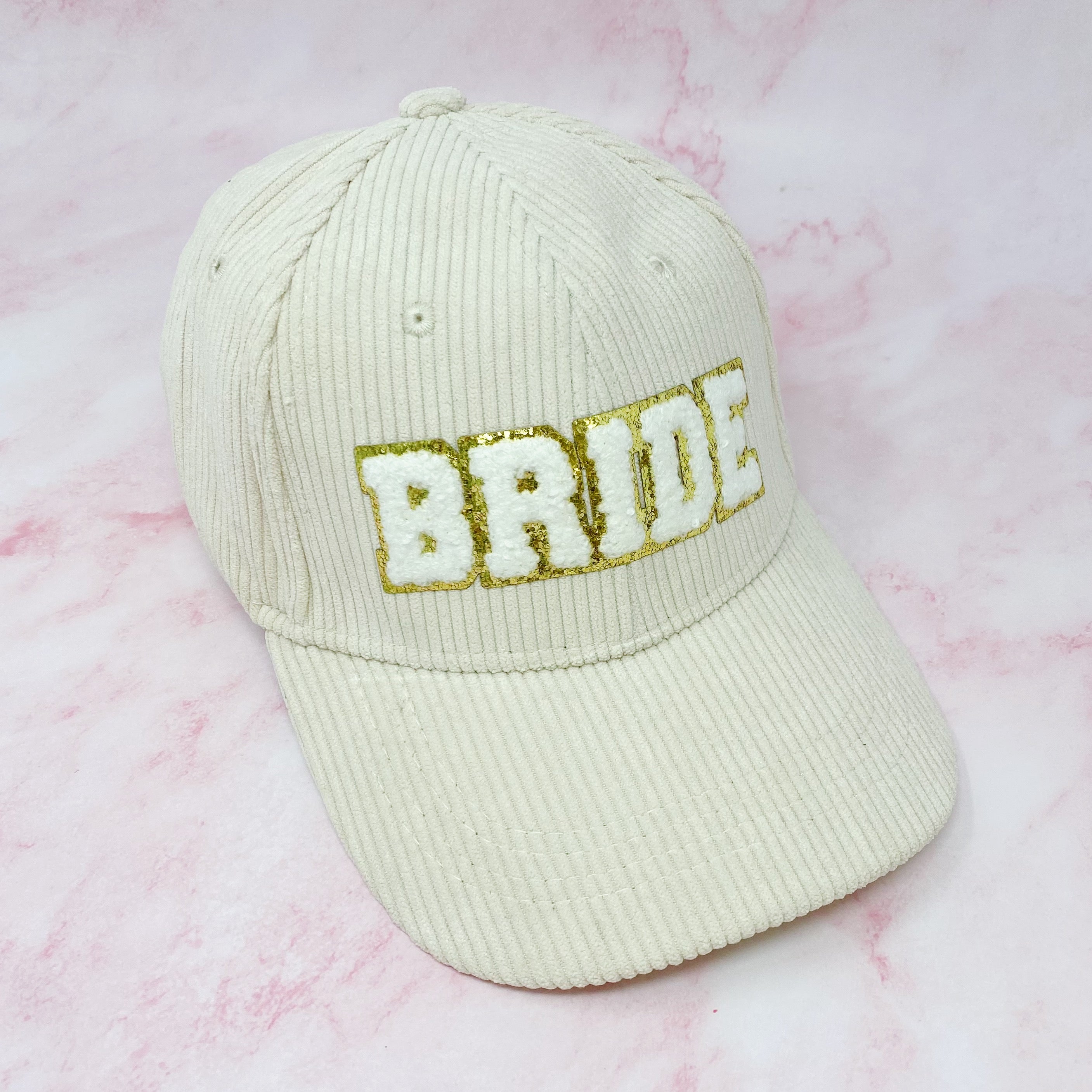 Bride Corduroy Ball Cap featuring gold glittering fuzzy patch lettering and adjustable strap.