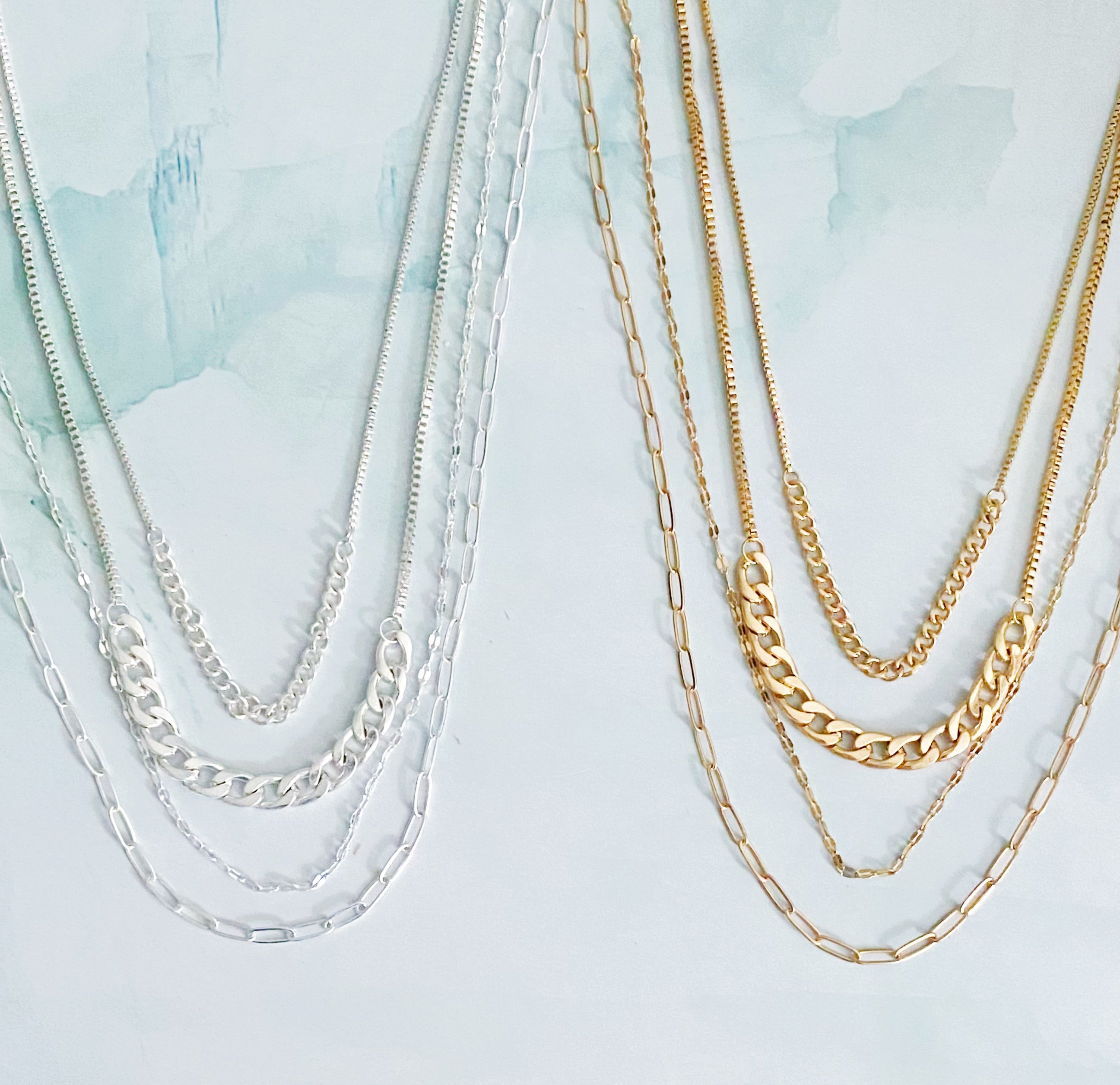 Brooklyn Four Chains Necklace Set of 3 featuring layered Cuban, link, and textured chains in alloy metal.