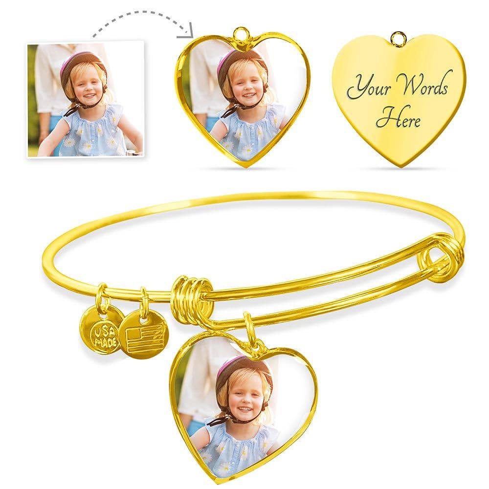 BU Heart Bangle featuring a heart pendant, crafted from surgical steel with a gold finish, adjustable size for comfort.