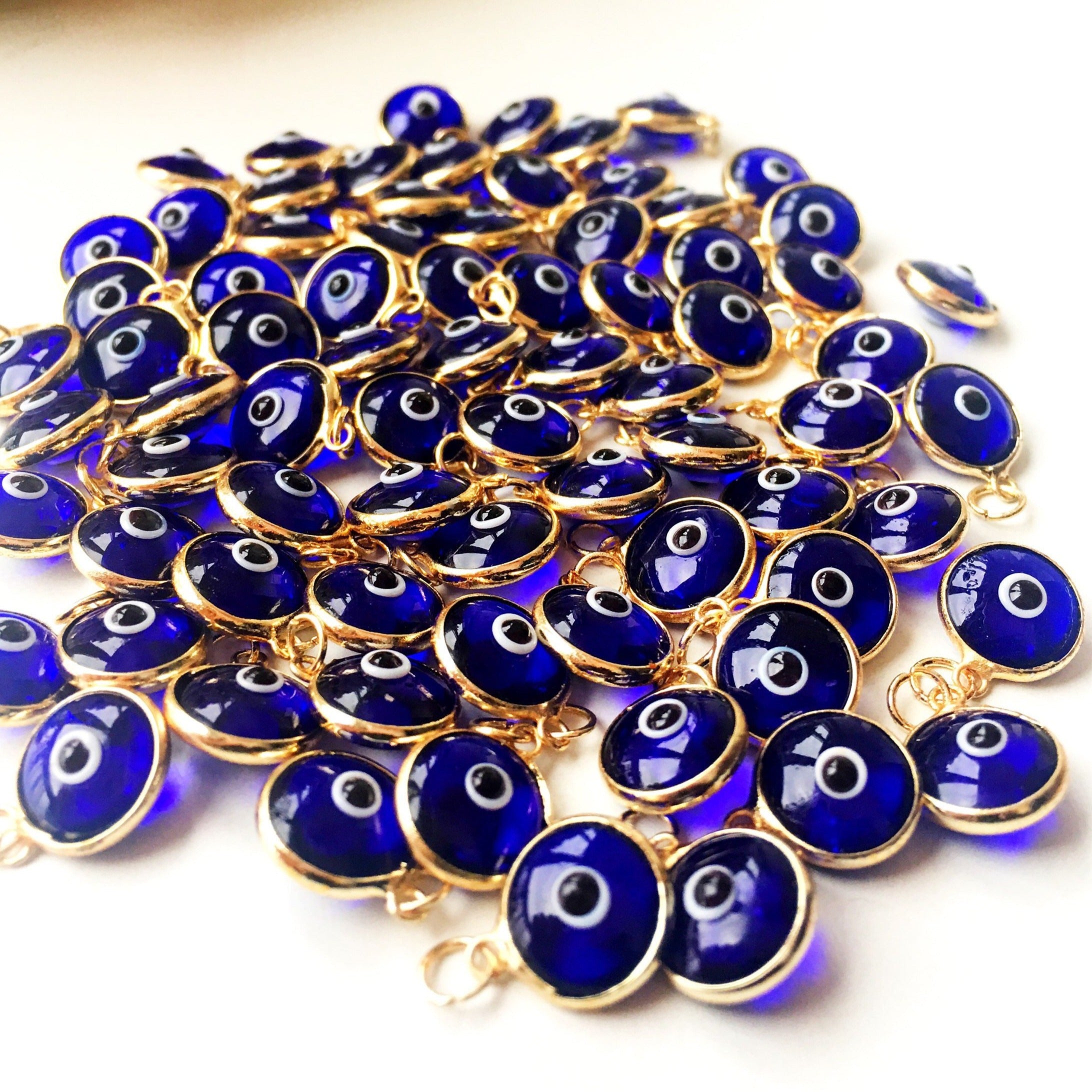 A bulk set of blue evil eye beads, showcasing their vibrant color and intricate design, perfect for jewelry making.