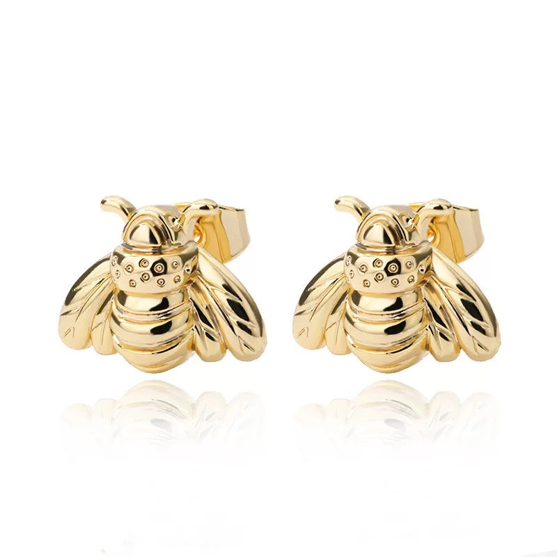 A pair of stylish Bumble Bee Stud Earrings made from plated copper, featuring intricate bee designs.