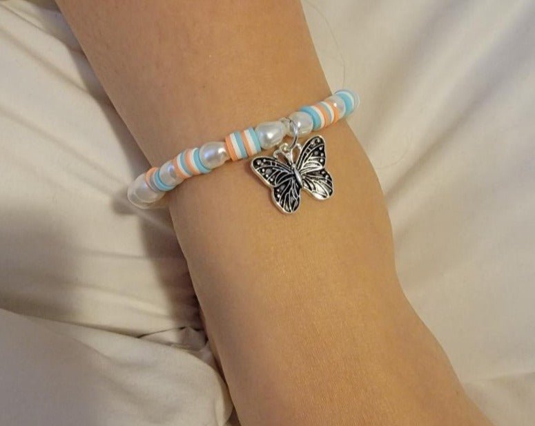 A stylish Butterfly Anklet featuring pearls and beads with a unique butterfly charm, perfect for summer fashion.