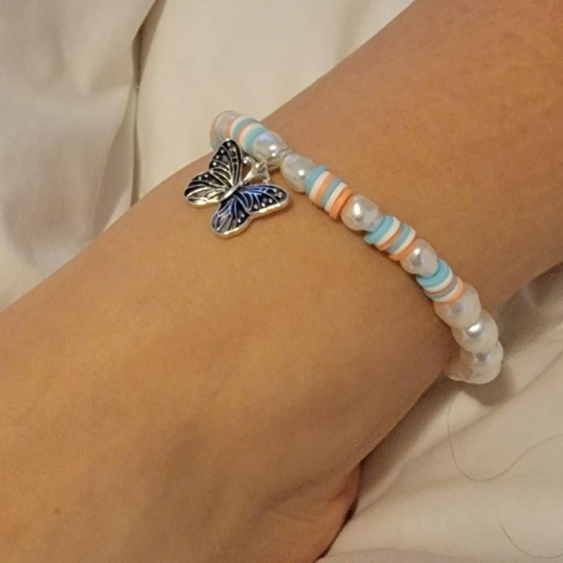 A stylish Butterfly Anklet featuring pearls and beads with a unique butterfly charm, perfect for summer fashion.