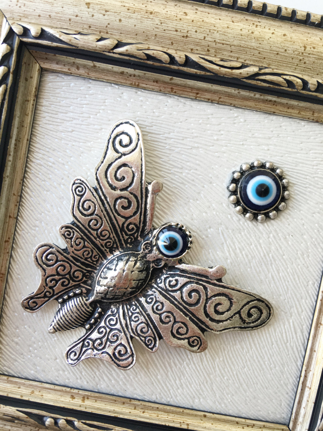 Handmade Butterfly Evil Eye Wall Decor featuring a silver butterfly and a small evil eye, perfect for home decoration.