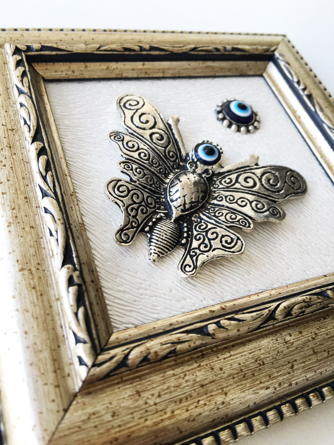 Handmade Butterfly Evil Eye Wall Decor featuring a silver butterfly and a small evil eye, perfect for home decoration.