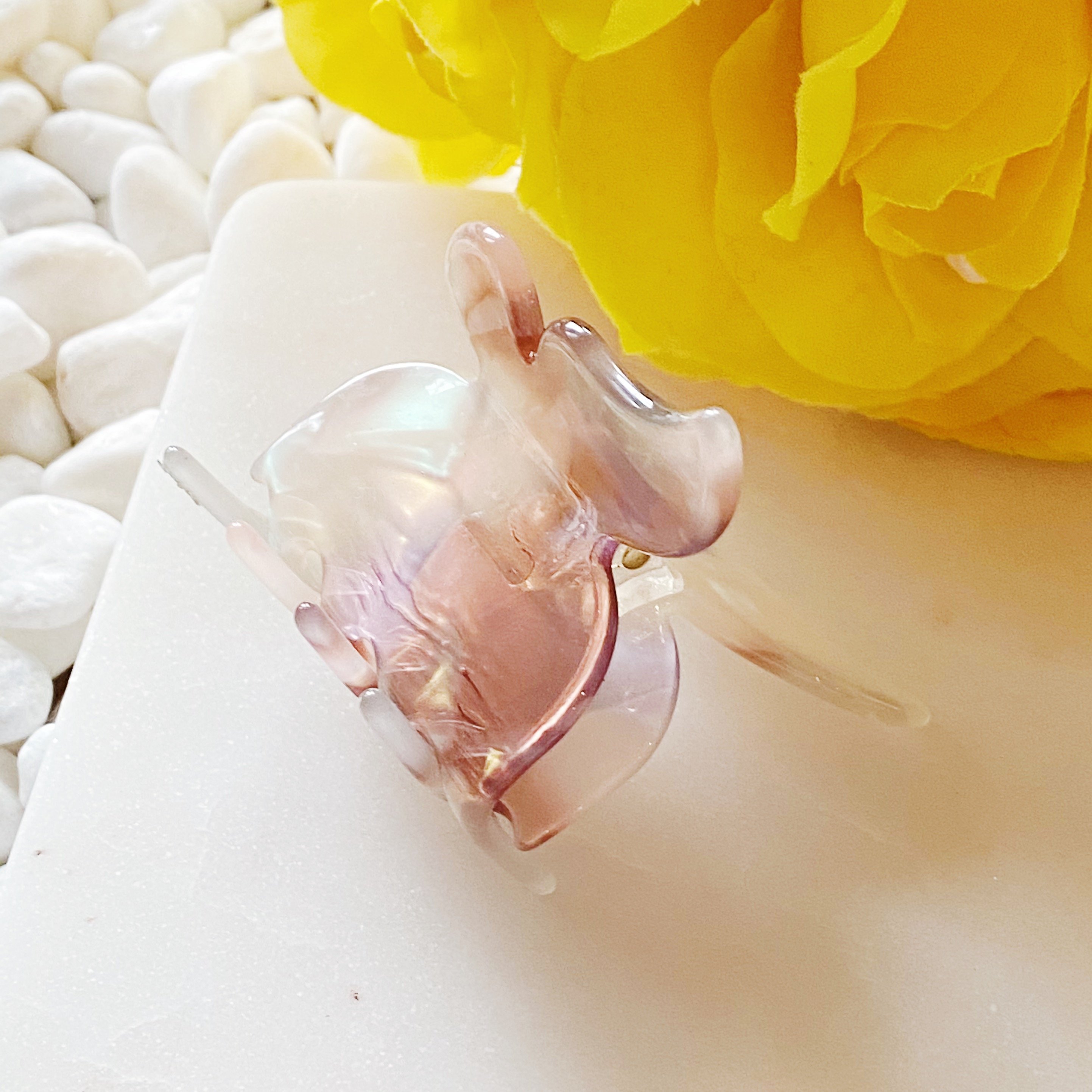 A stylish butterfly-shaped acrylic hair claw in elegant design, perfect for securing hair in various styles.