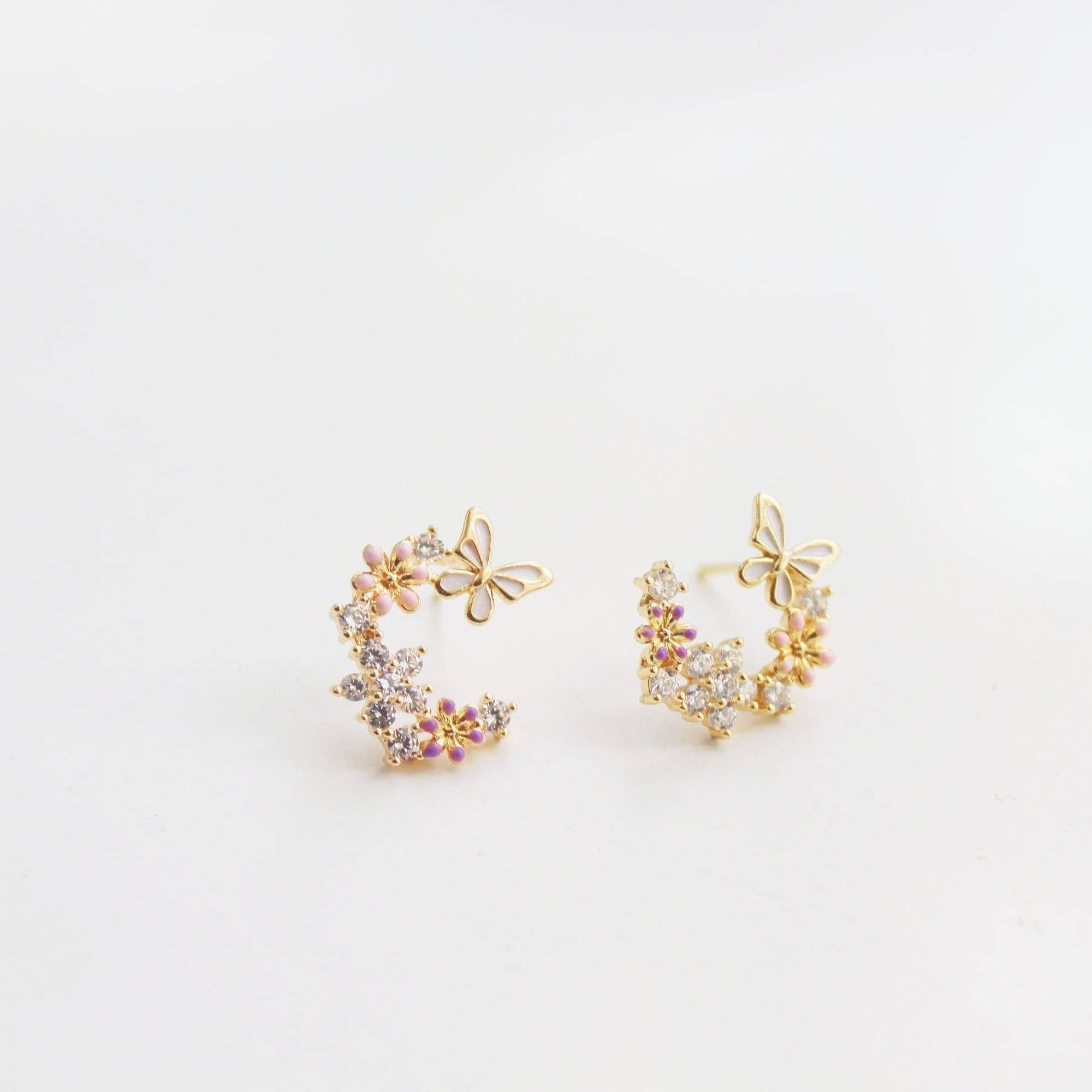 Elegant butterfly earrings featuring cherry blossom design, crafted from sterling silver and gold plated bronze.