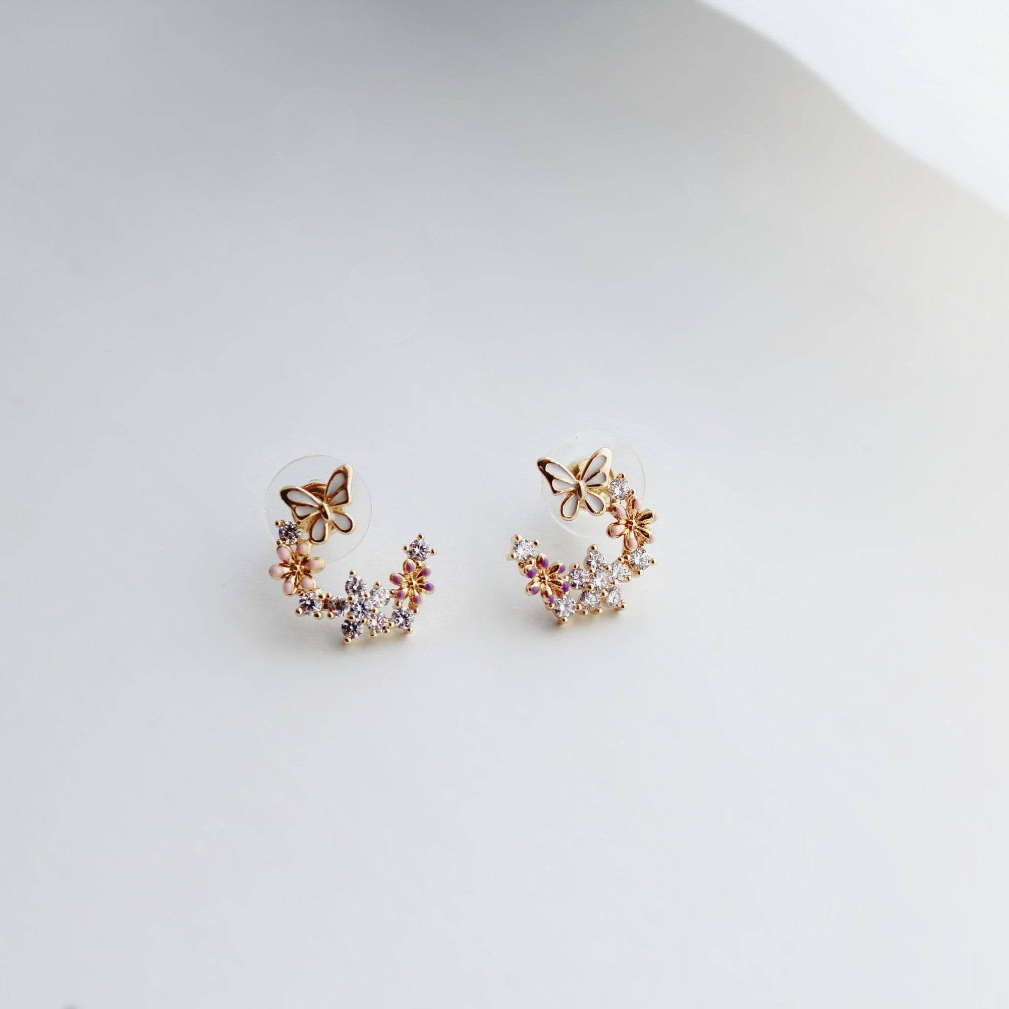 Elegant butterfly earrings featuring cherry blossom design, crafted from sterling silver and gold plated bronze.