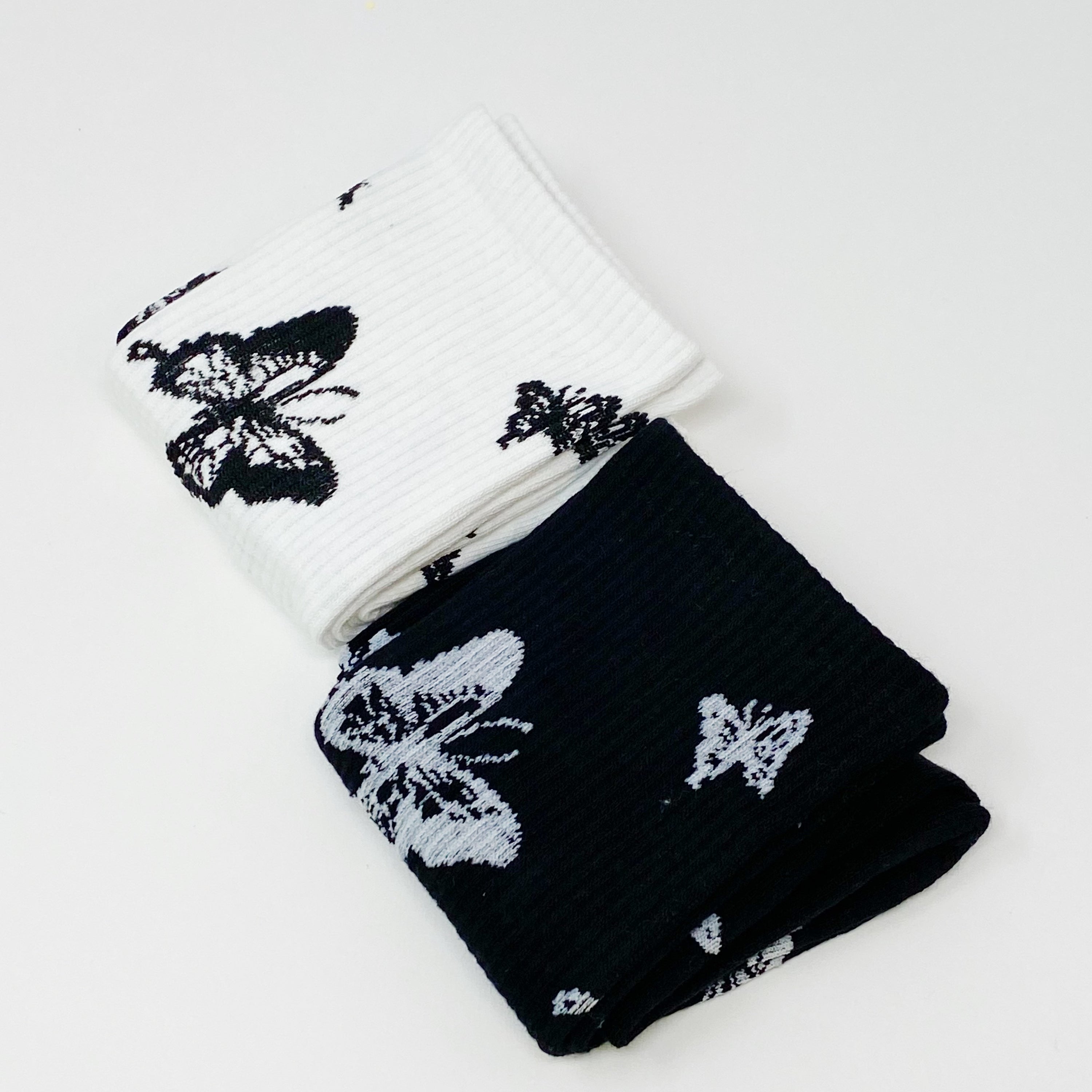 Butterfly In The Air Socks Set featuring colorful butterfly designs, packaged in a clear cello bag with logo sticker.