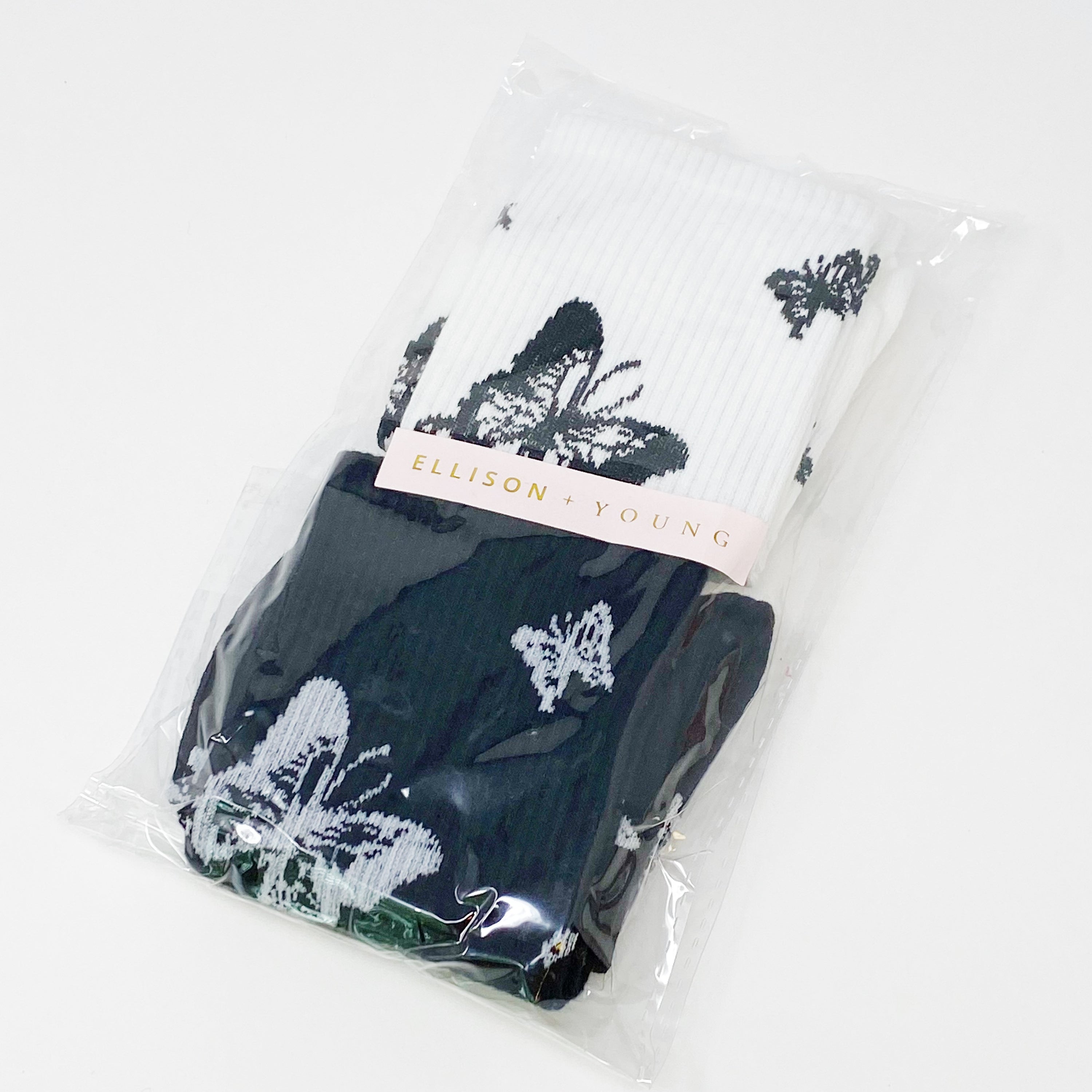 Butterfly In The Air Socks Set featuring colorful butterfly designs, packaged in a clear cello bag with logo sticker.