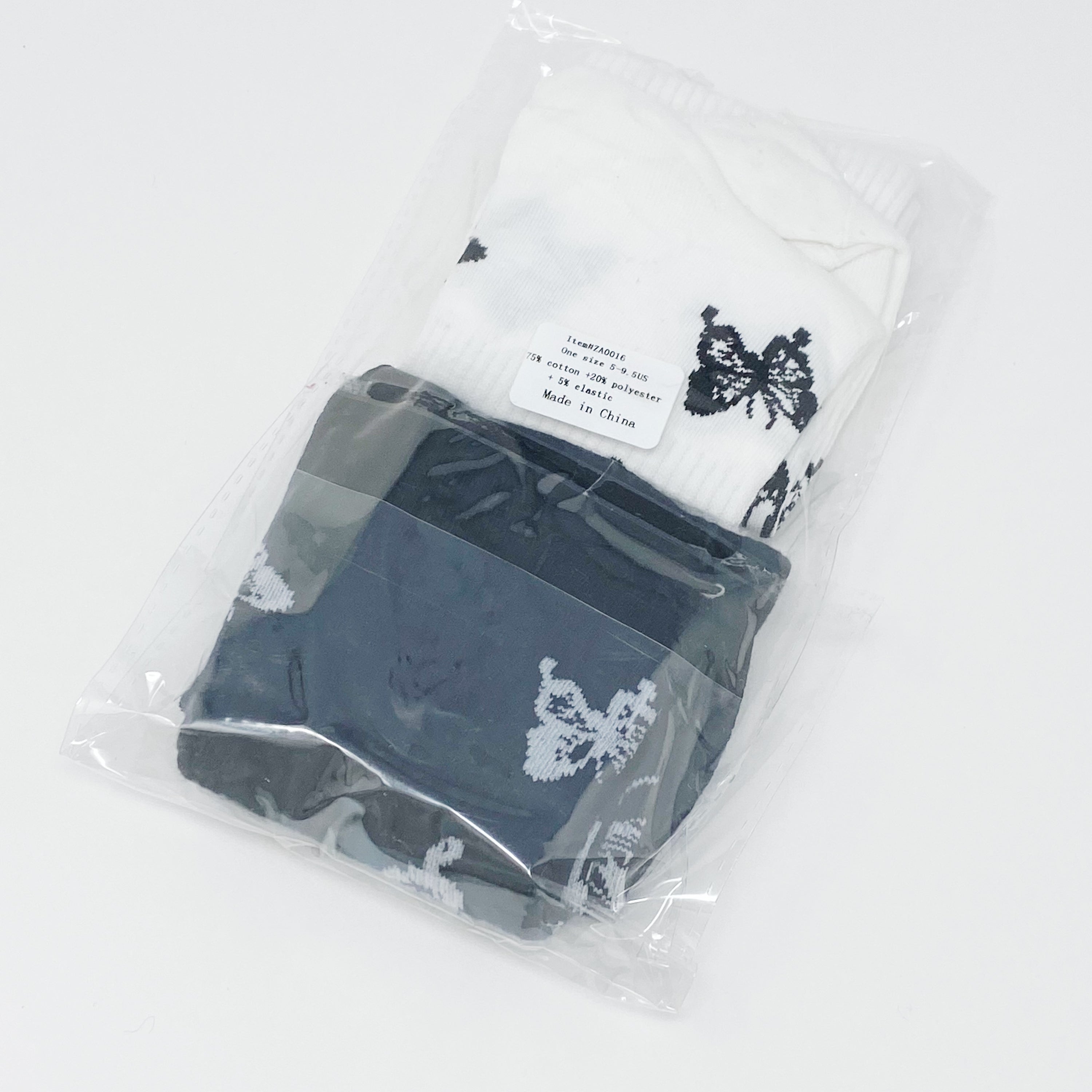 Butterfly In The Air Socks Set featuring colorful butterfly designs, packaged in a clear cello bag with logo sticker.