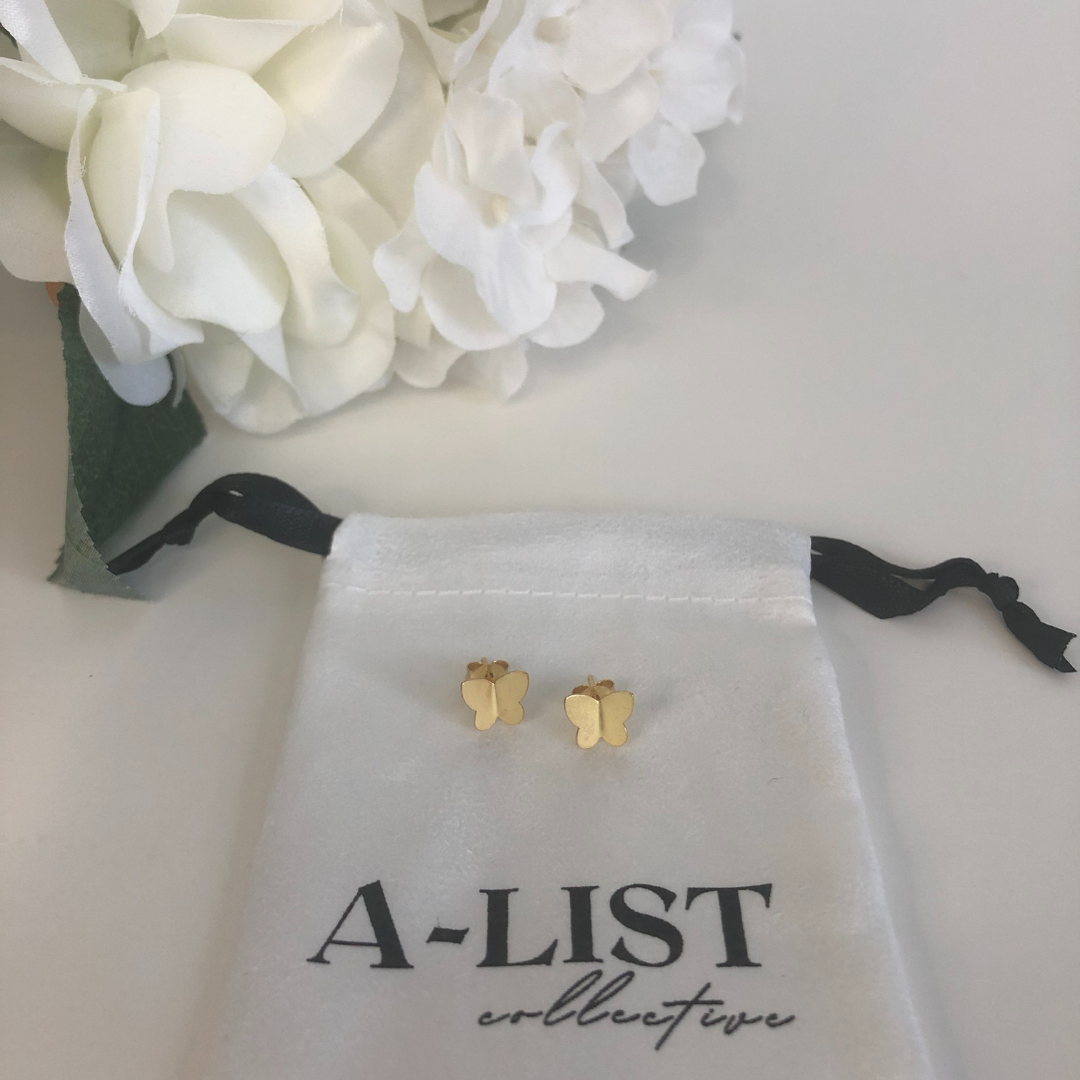 A pair of elegant butterfly stud earrings made from sterling silver and gold-dipped options, showcasing intricate design and shine.