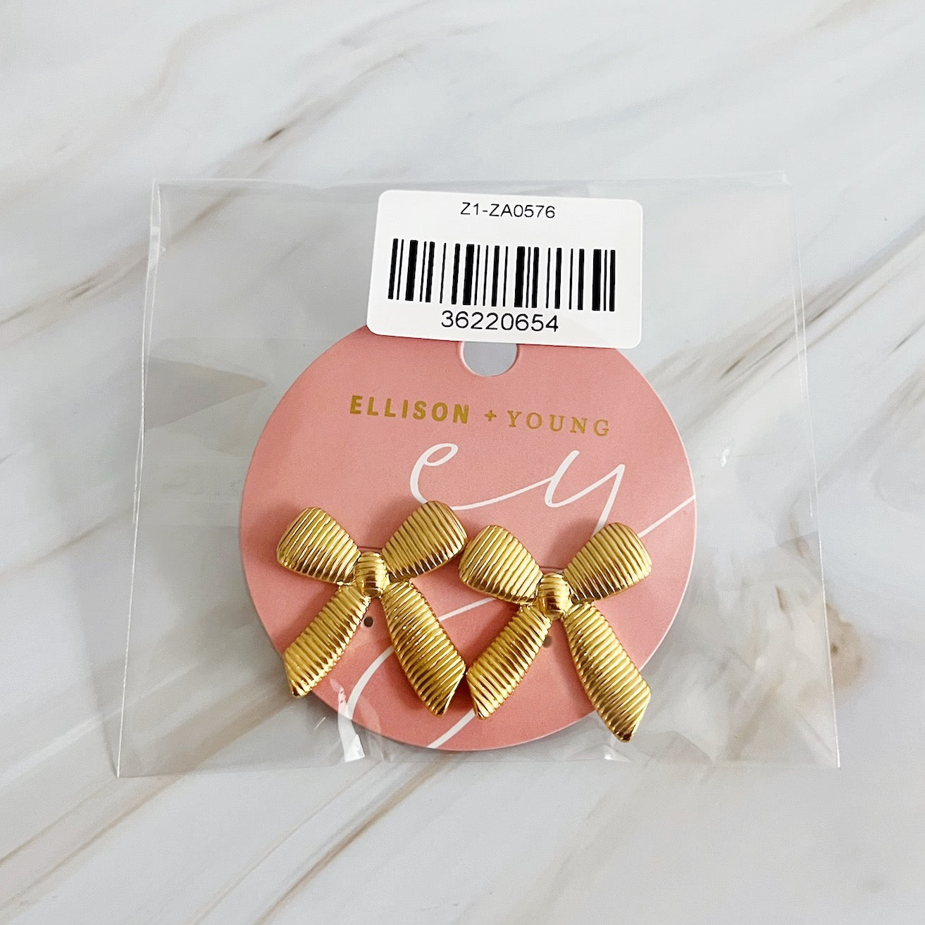 Elegant Cabled Bow Stud Earrings in 18k gold plated stainless steel, showcasing a unique cabling design.