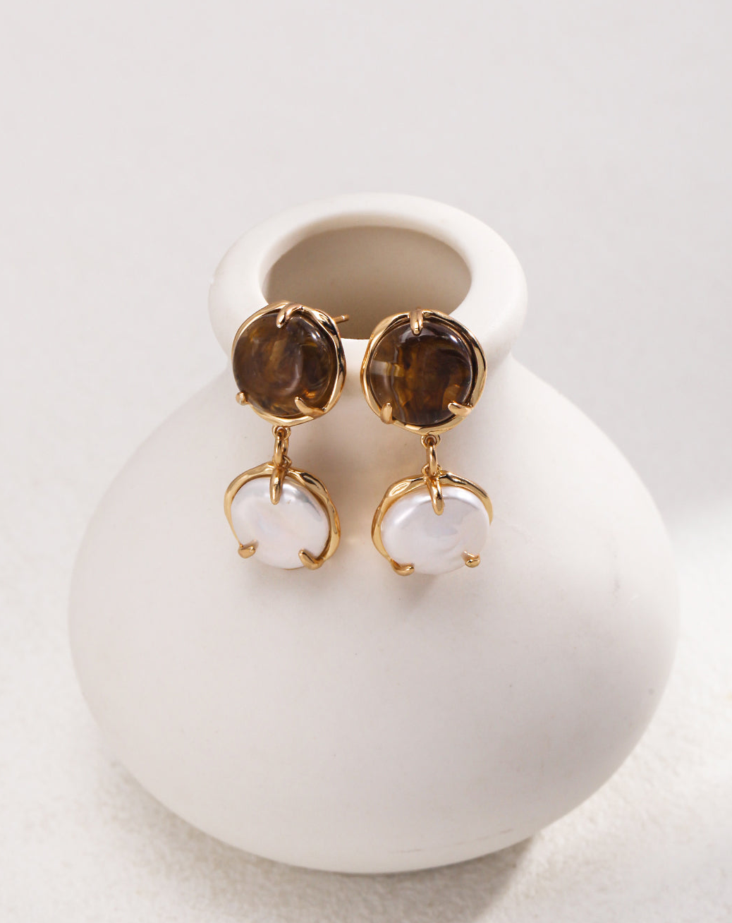 Café Au Lait Mini Pearl Ball Earring featuring vintage gold, coffee-colored resin, and delicate pearls, showcasing adjustable design for comfort.