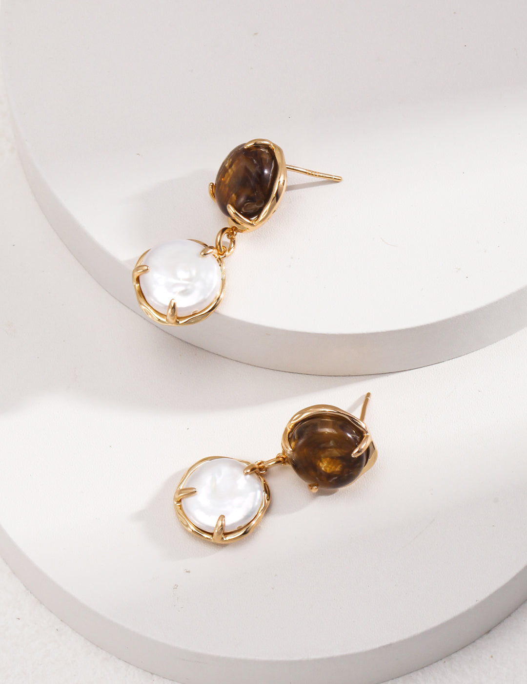 Café Au Lait Mini Pearl Ball Earring featuring vintage gold, coffee-colored resin, and delicate pearls, showcasing adjustable design for comfort.