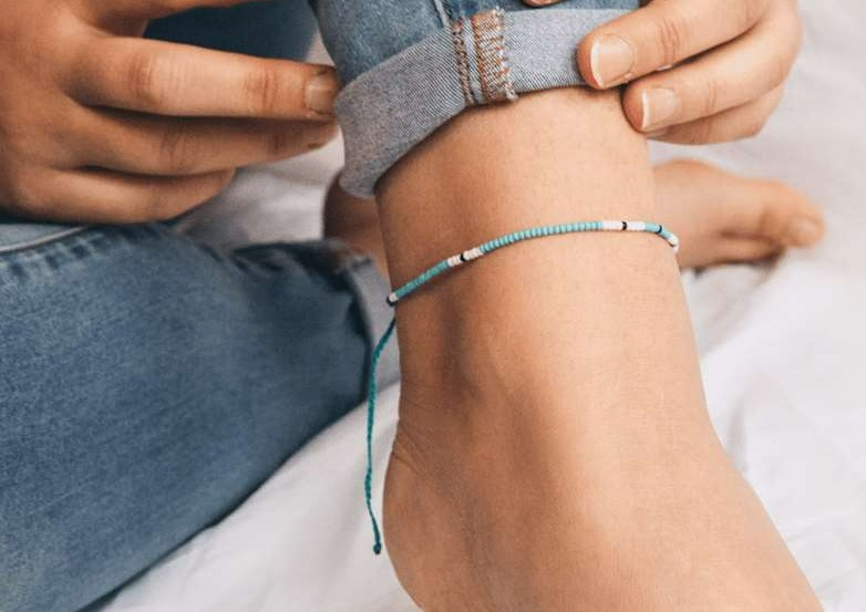 Cali Surf Anklet in blue with multi-colored beads, handmade in Bali, showcasing vibrant summer style.