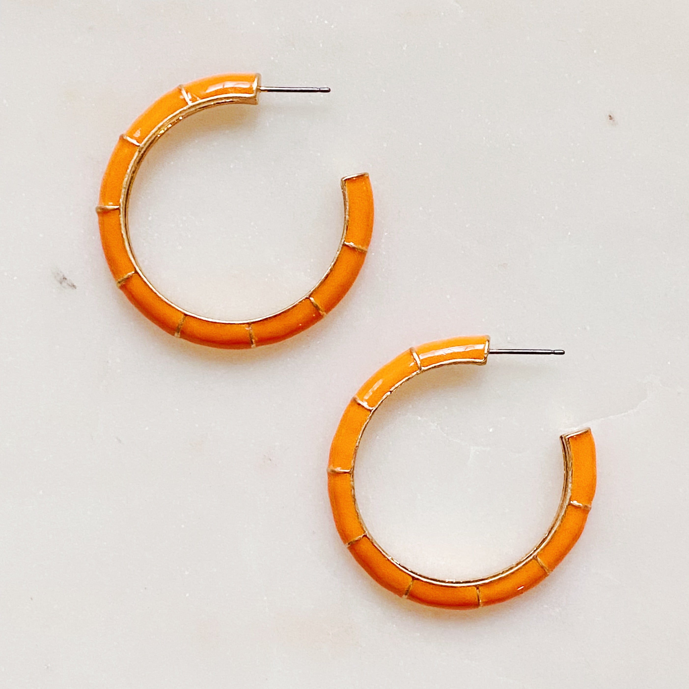 Candy Drop Colored Hoop Earrings featuring vibrant enamel finish and gold plated alloy metal, perfect for everyday wear.