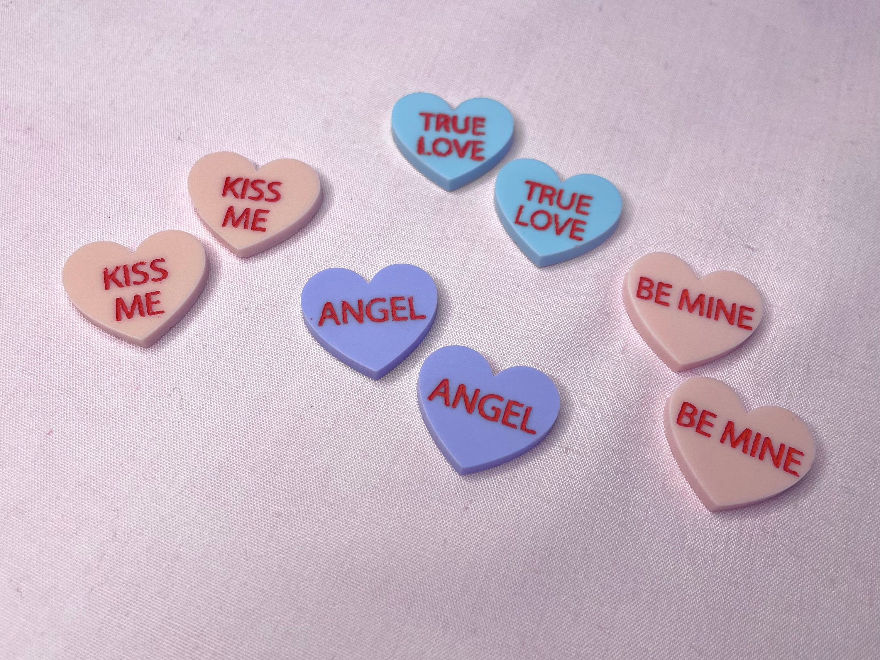 Colorful Candy Heart Stud Earrings featuring a playful design, made from laser cut acrylic, inspired by 1960s and 70s fashion trends.