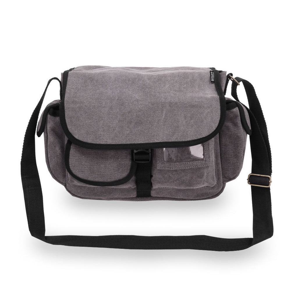 A large cotton canvas messenger bag with two side pockets and a front flap, showcasing its spacious design and stylish appearance.