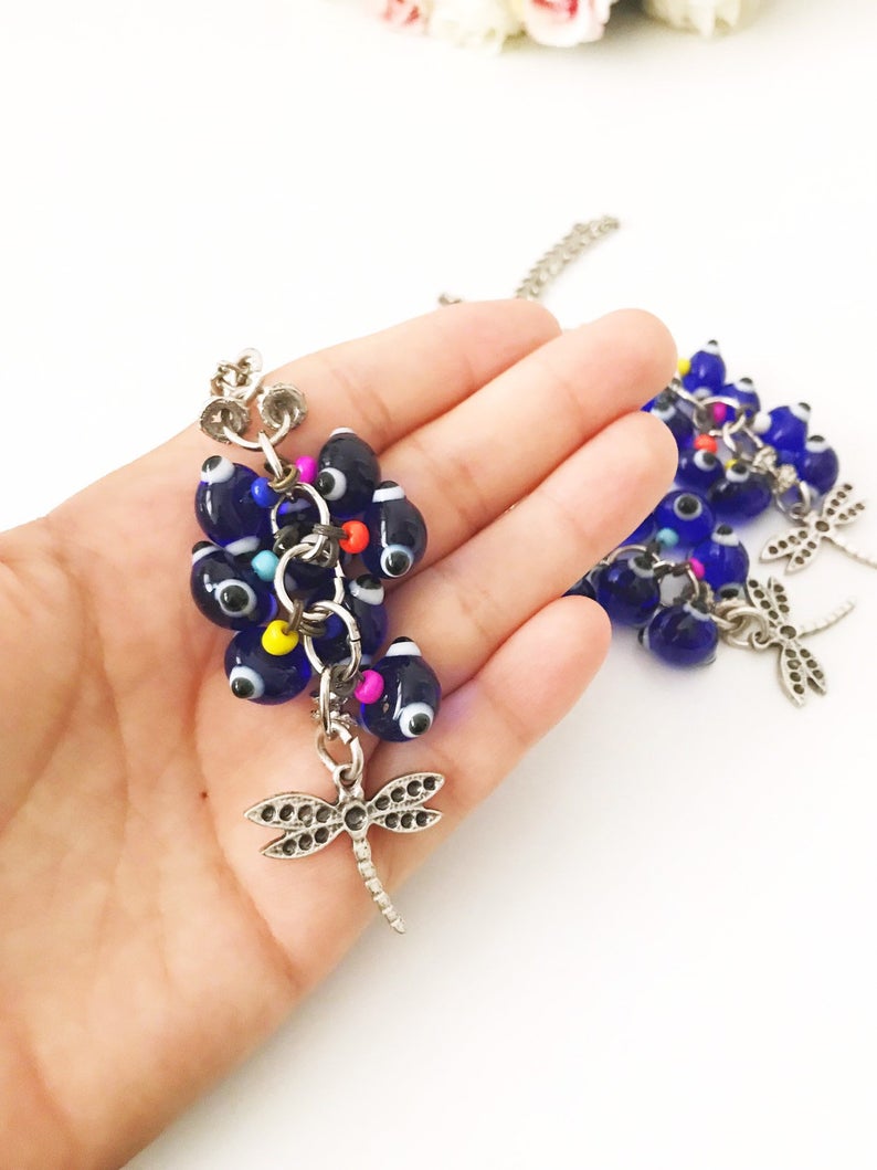 Handmade car rear view mirror charm featuring a dragonfly design, glass beads, and a silver charm, perfect for adding elegance to your vehicle.