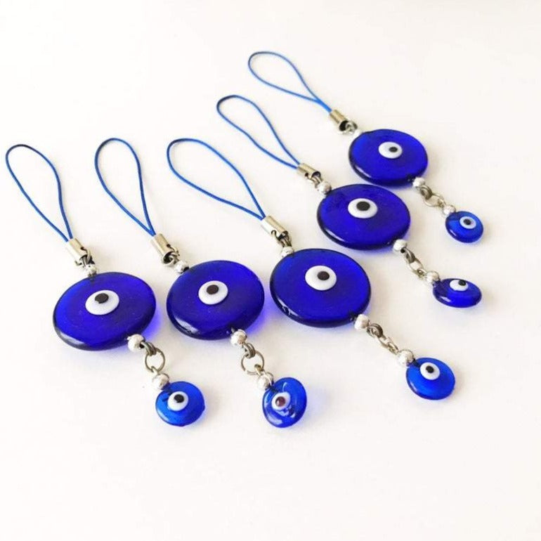 Handmade car rear view mirror charm featuring blue glass evil eye beads, symbolizing protection and good luck.