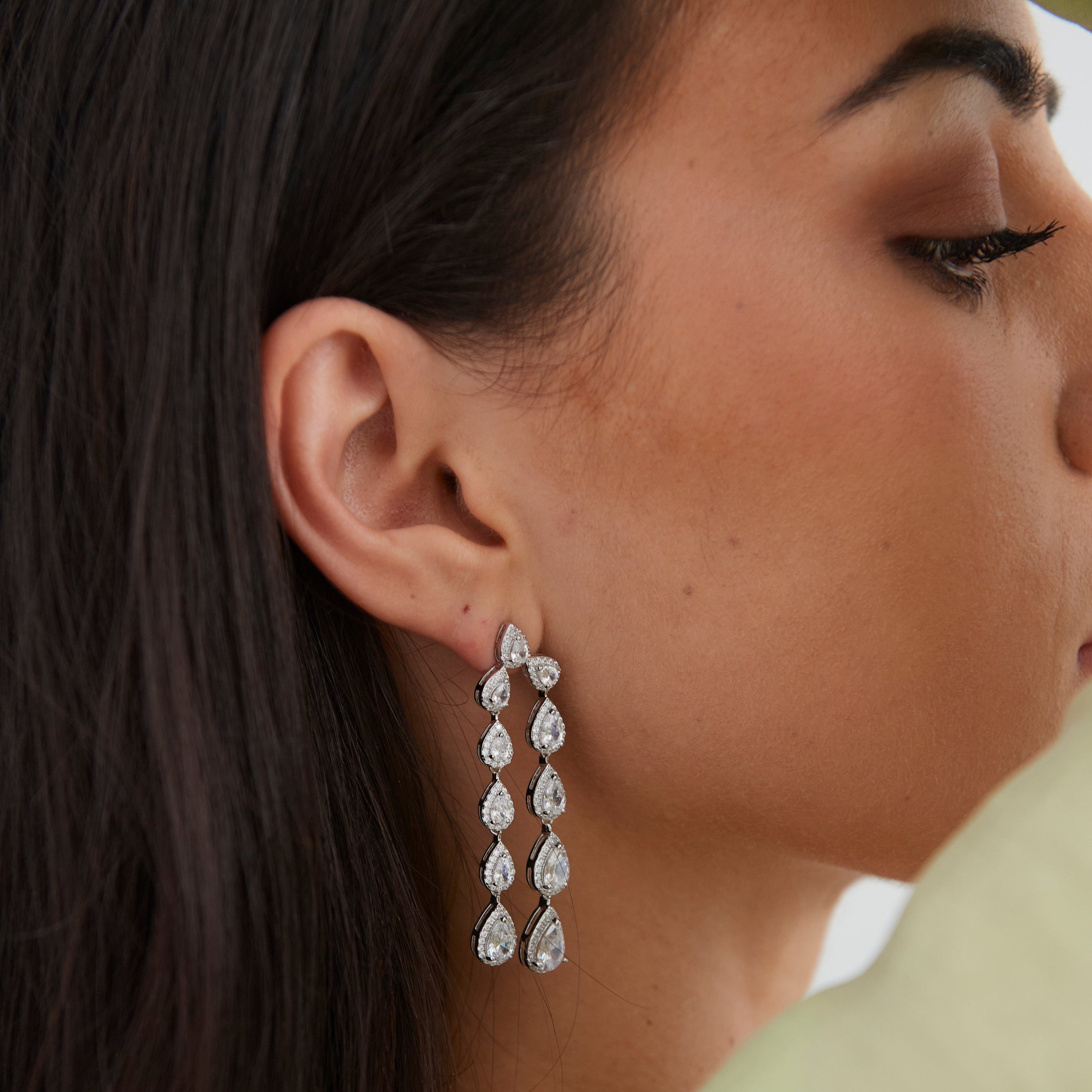 Elegant Carrington Cz Drop Earrings featuring large and mini cz stones set in sterling silver, showcasing a stunning 2.5-inch drop design.