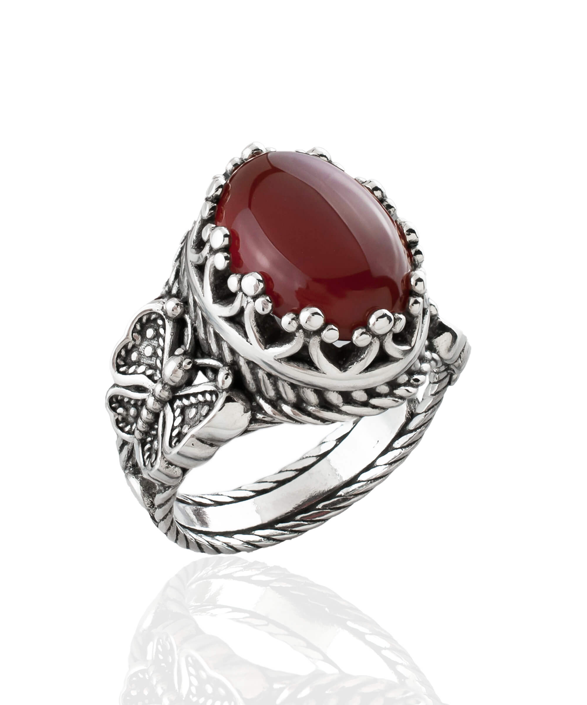 Elegant silver ring featuring intricate filigree butterfly design and a dark red carnelian gemstone.