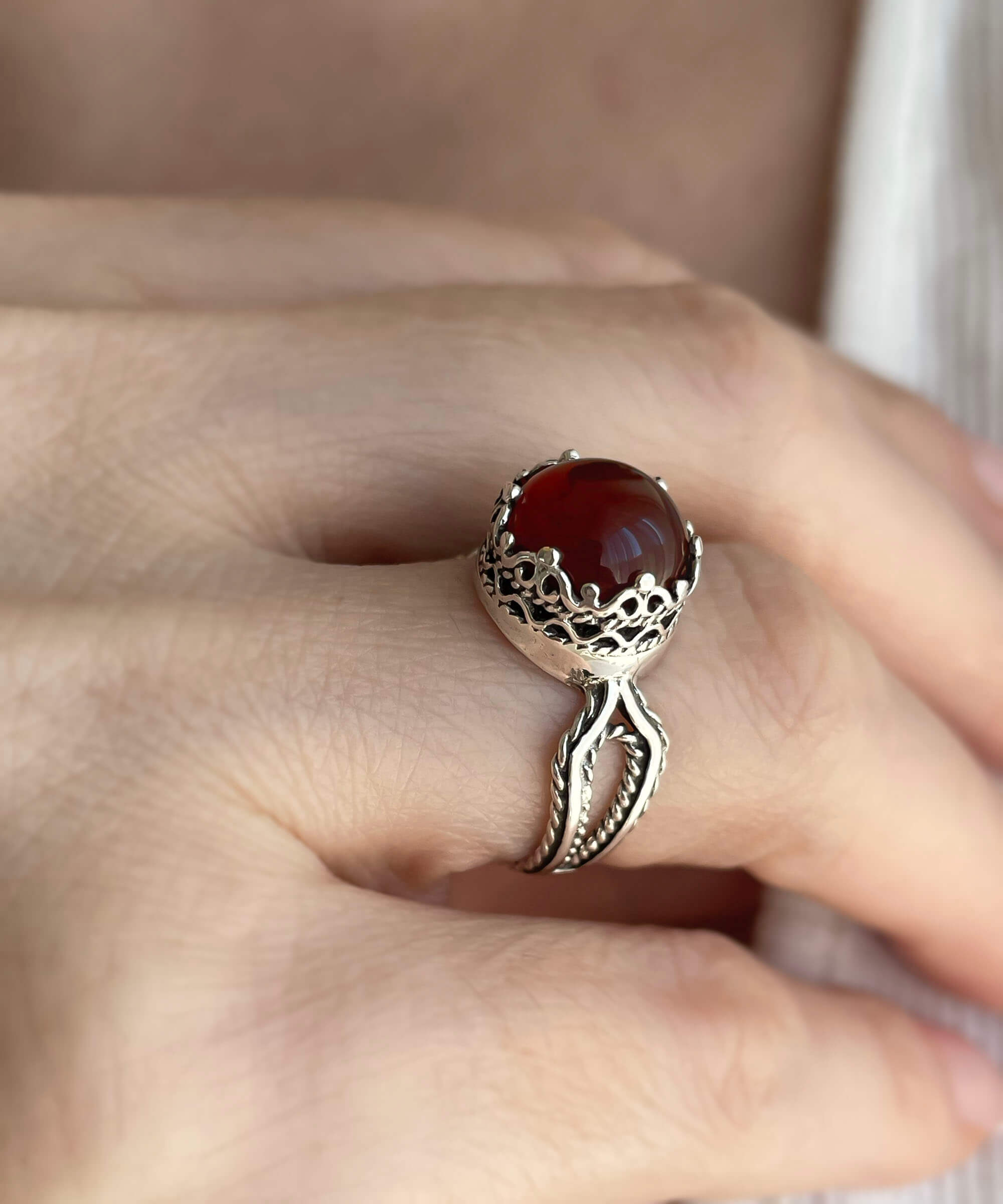 Elegant Carnelian gemstone filigree art cocktail ring made of 925 sterling silver, featuring a round cabochon cut stone.