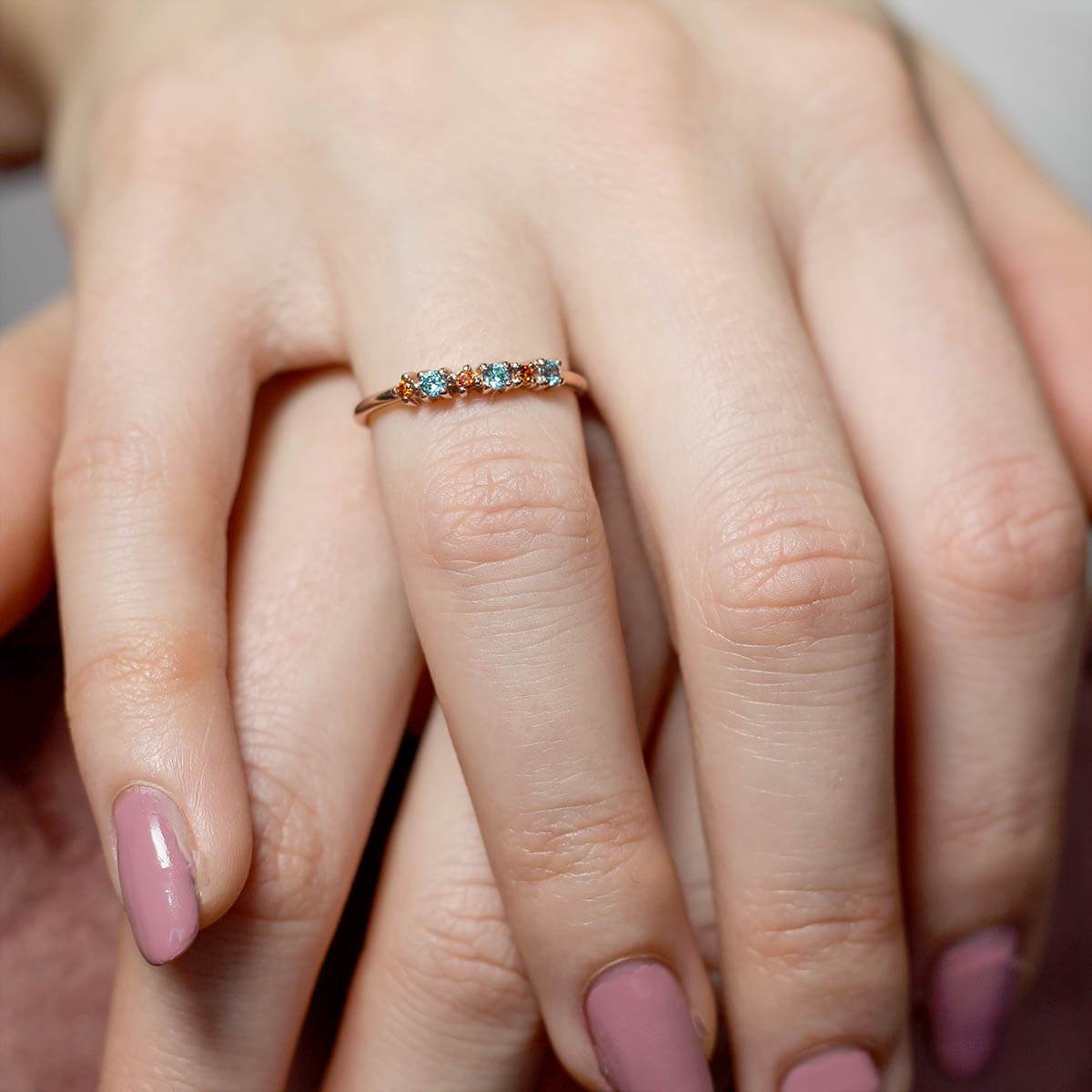 Carnival slim stacking ring featuring colorful sapphires set in sterling silver, showcasing a chic and elegant design.