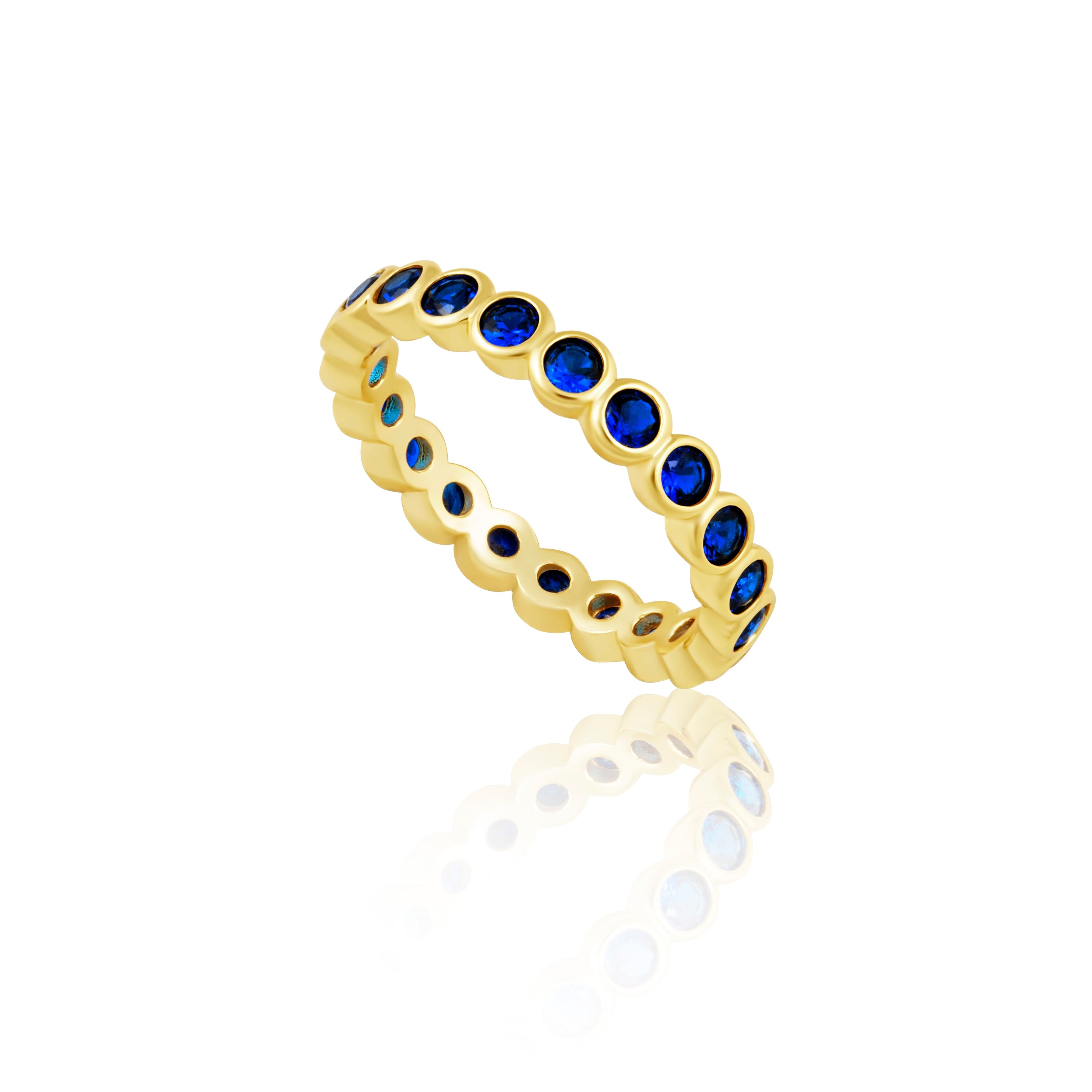 Celeste Eternity Ring featuring sapphire stones set in 18k gold filled over sterling silver, showcasing an elegant and stackable design.