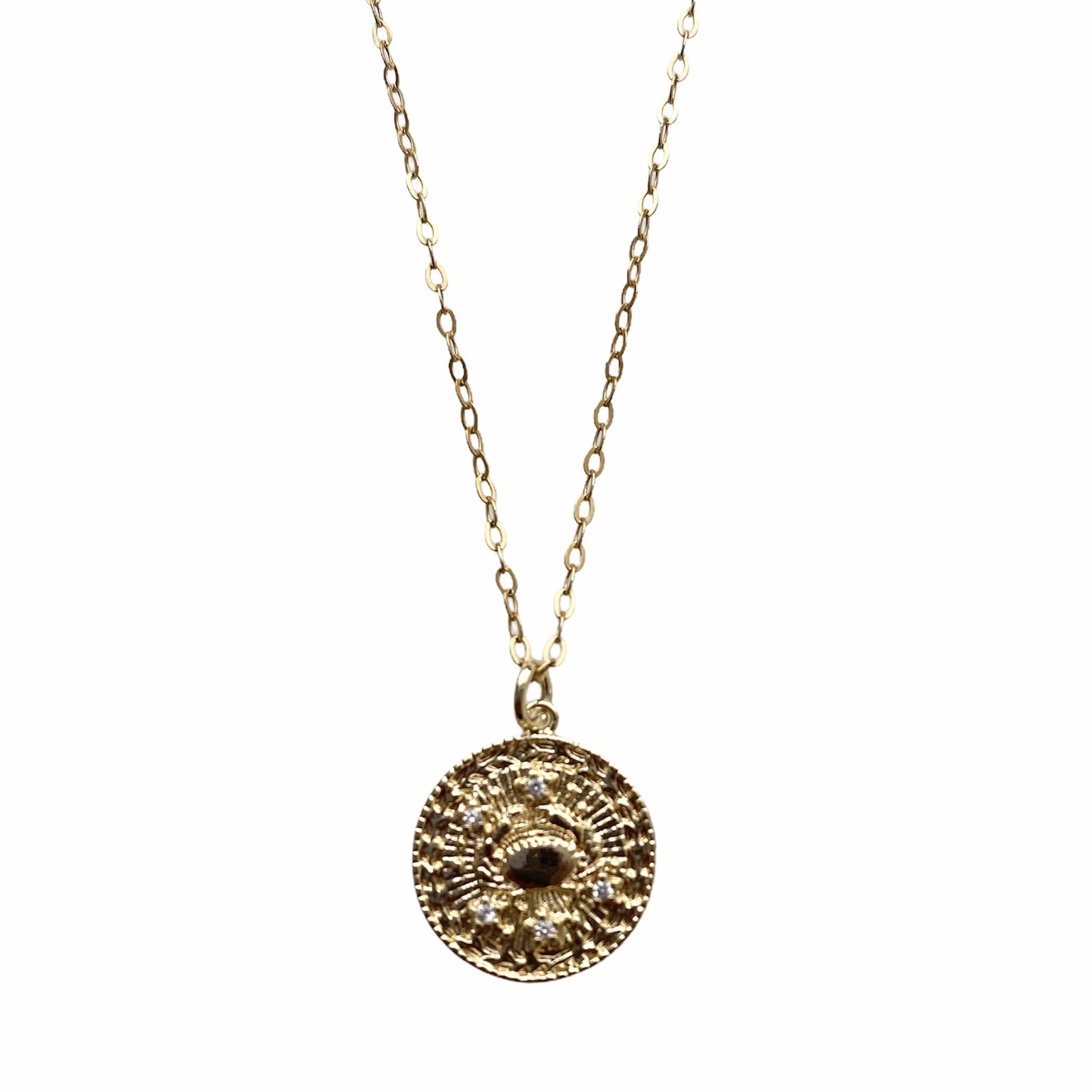 Celestial Vibes Zodiac Necklace featuring a 14K gold filled chain and zirconia encrusted pendant, elegantly displayed.