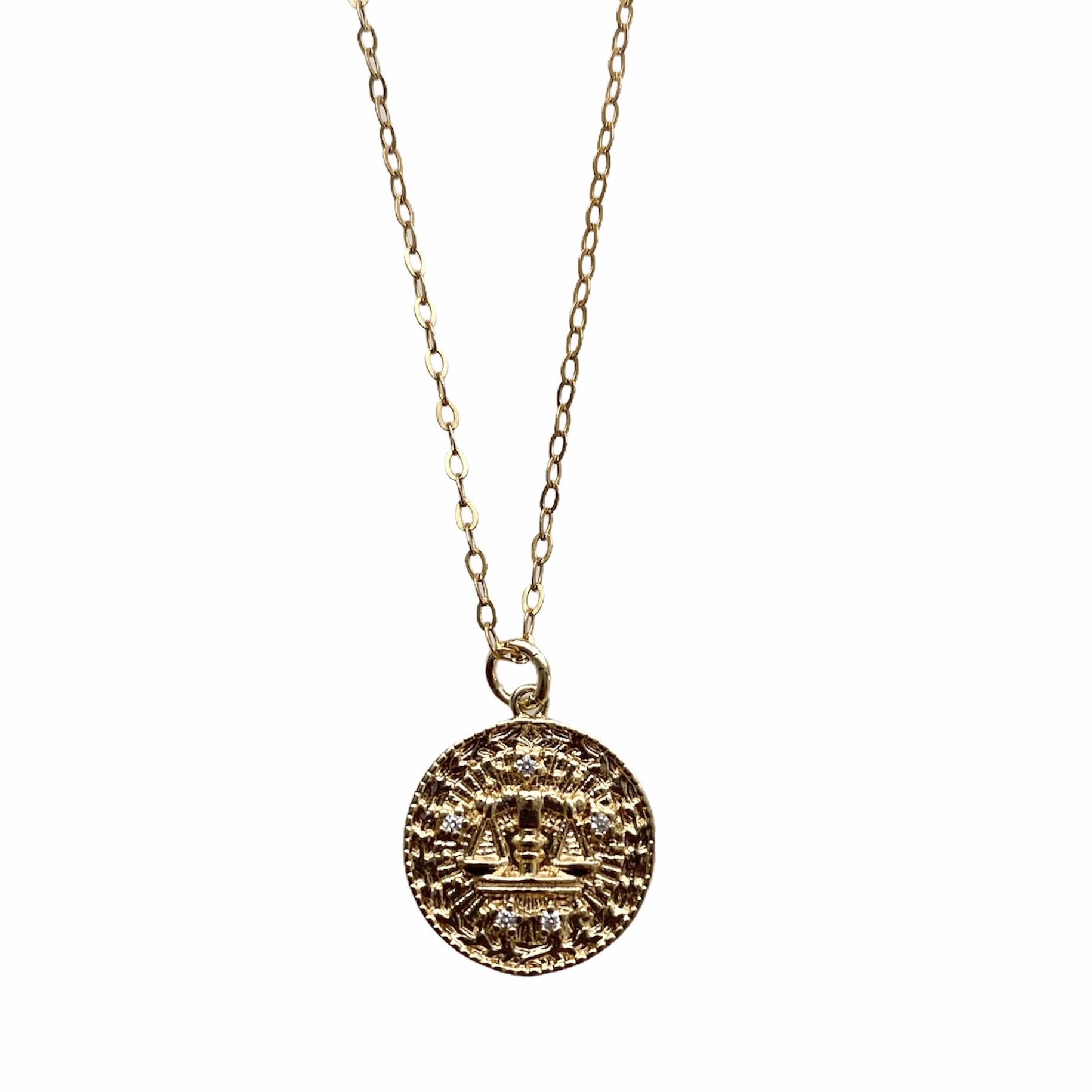 Celestial Vibes Zodiac Necklace featuring a 14K gold filled chain and zirconia encrusted pendant, elegantly displayed.