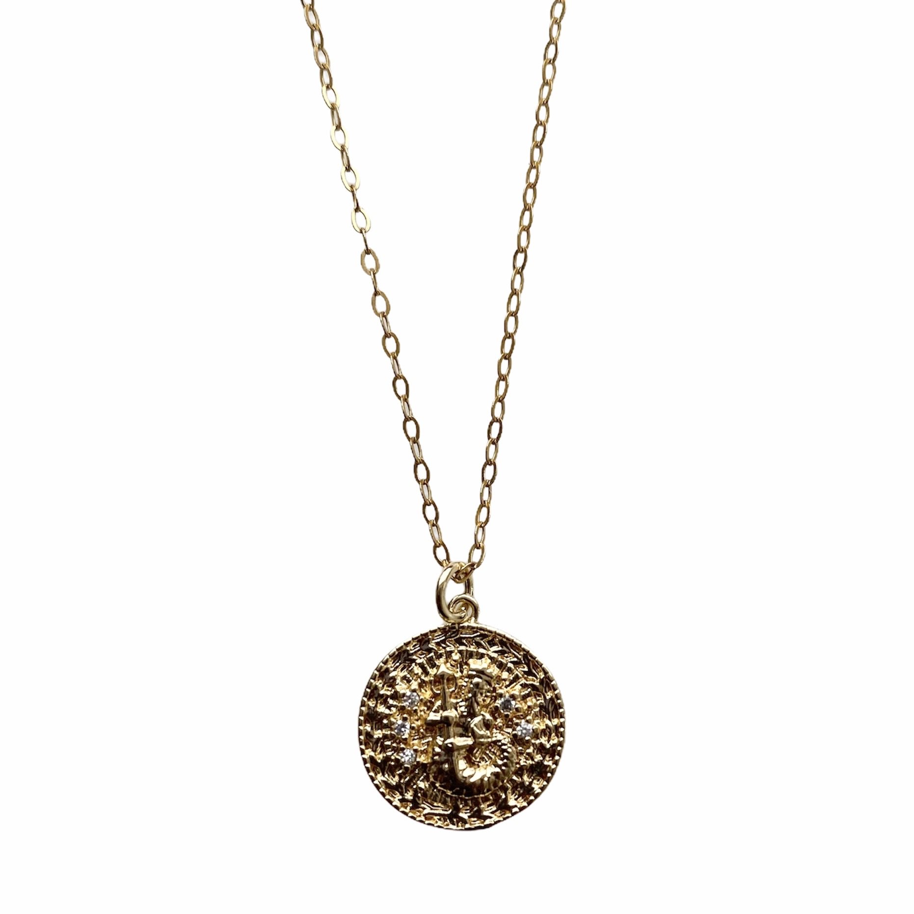 Celestial Vibes Zodiac Necklace featuring a 14K gold filled chain and zirconia encrusted pendant, elegantly displayed.