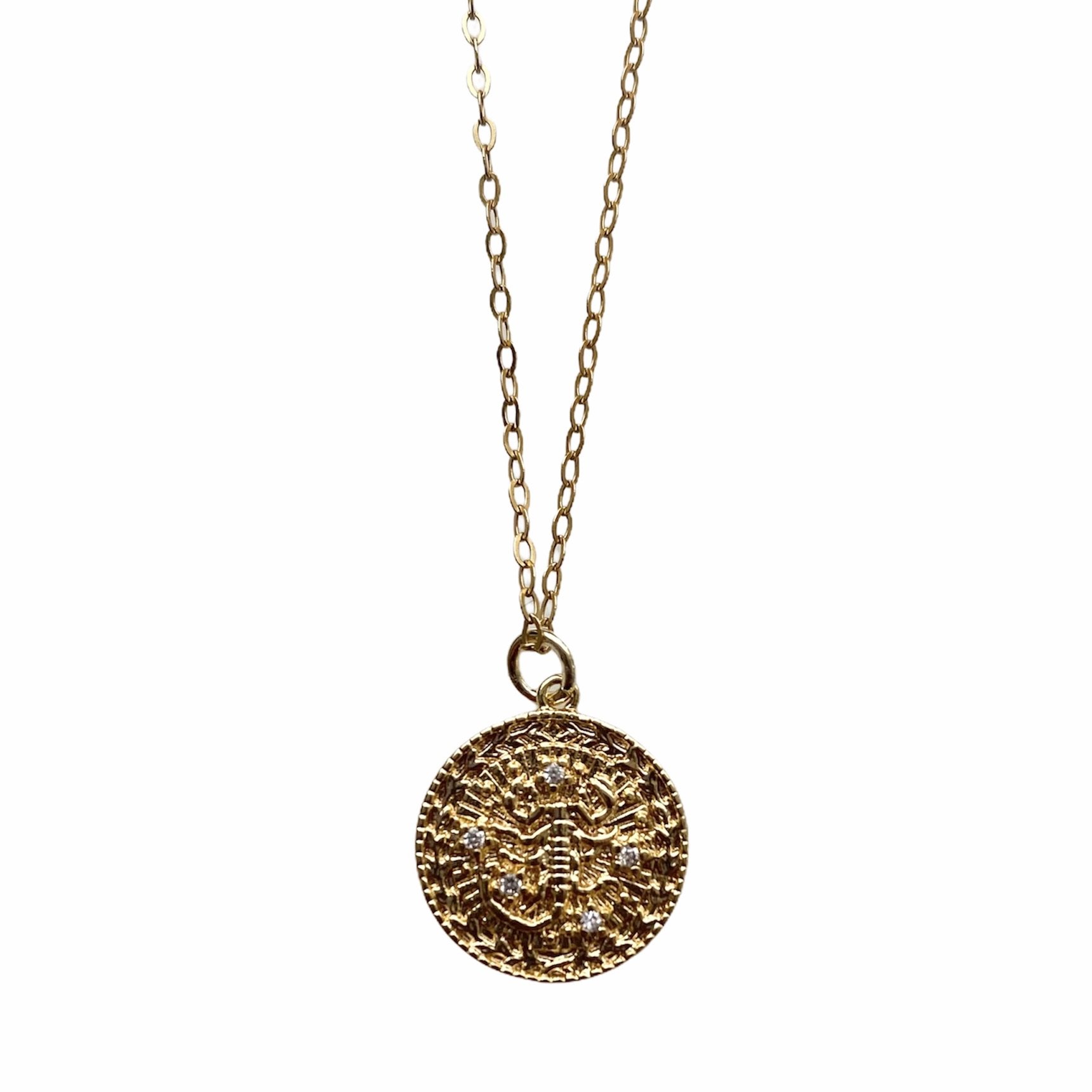 Celestial Vibes Zodiac Necklace featuring a 14K gold filled chain and zirconia encrusted pendant, elegantly displayed.